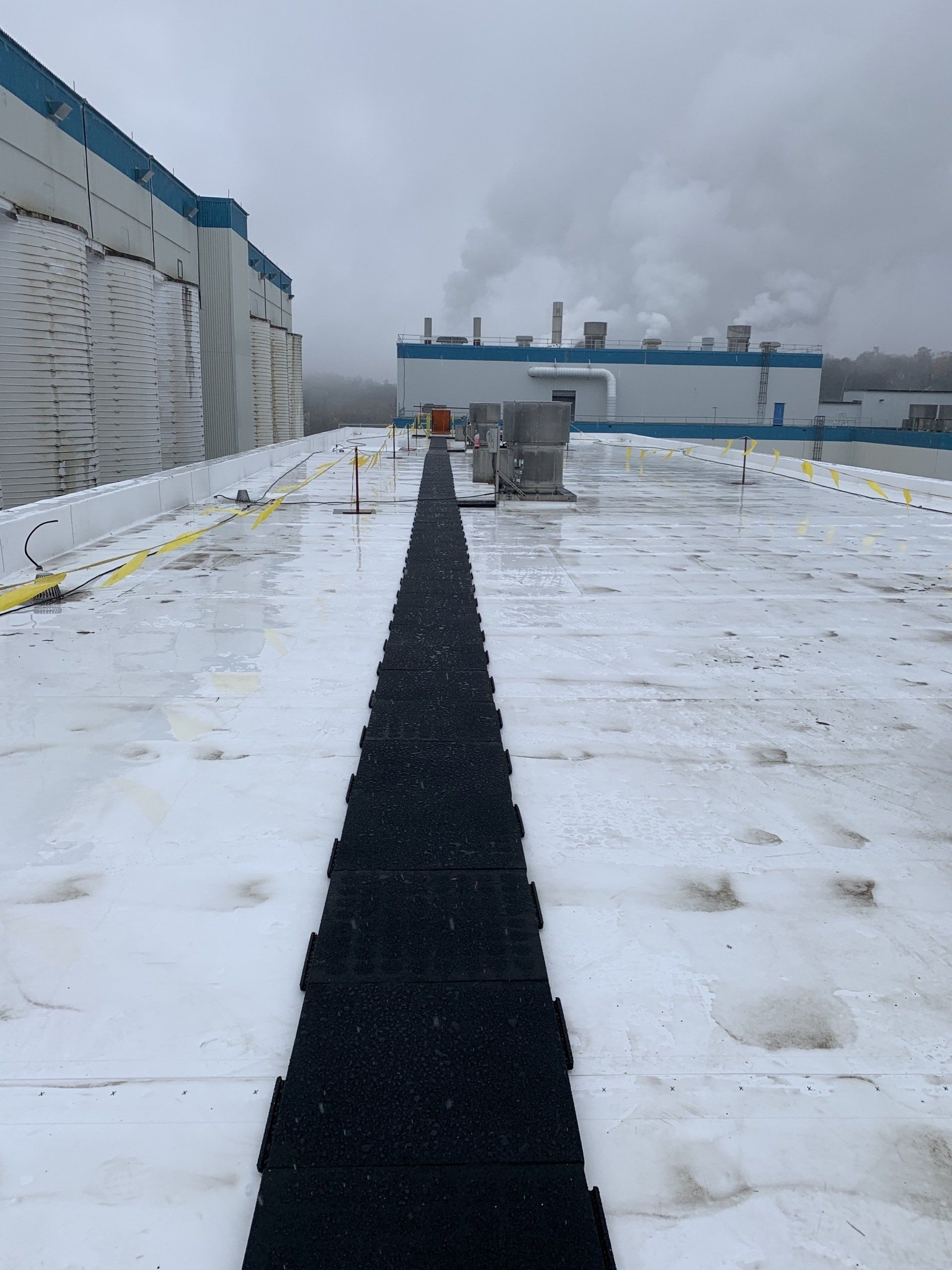 The roof of a building is covered in snow