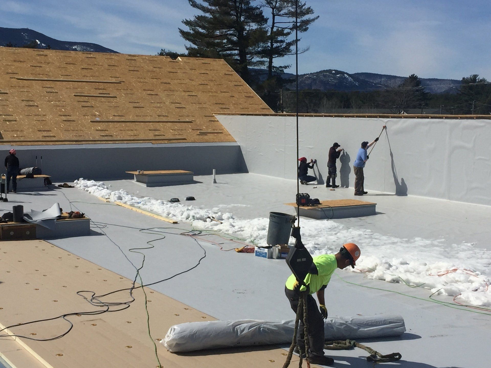 Rodd Roofing employees installing a new roof in New Hampshire