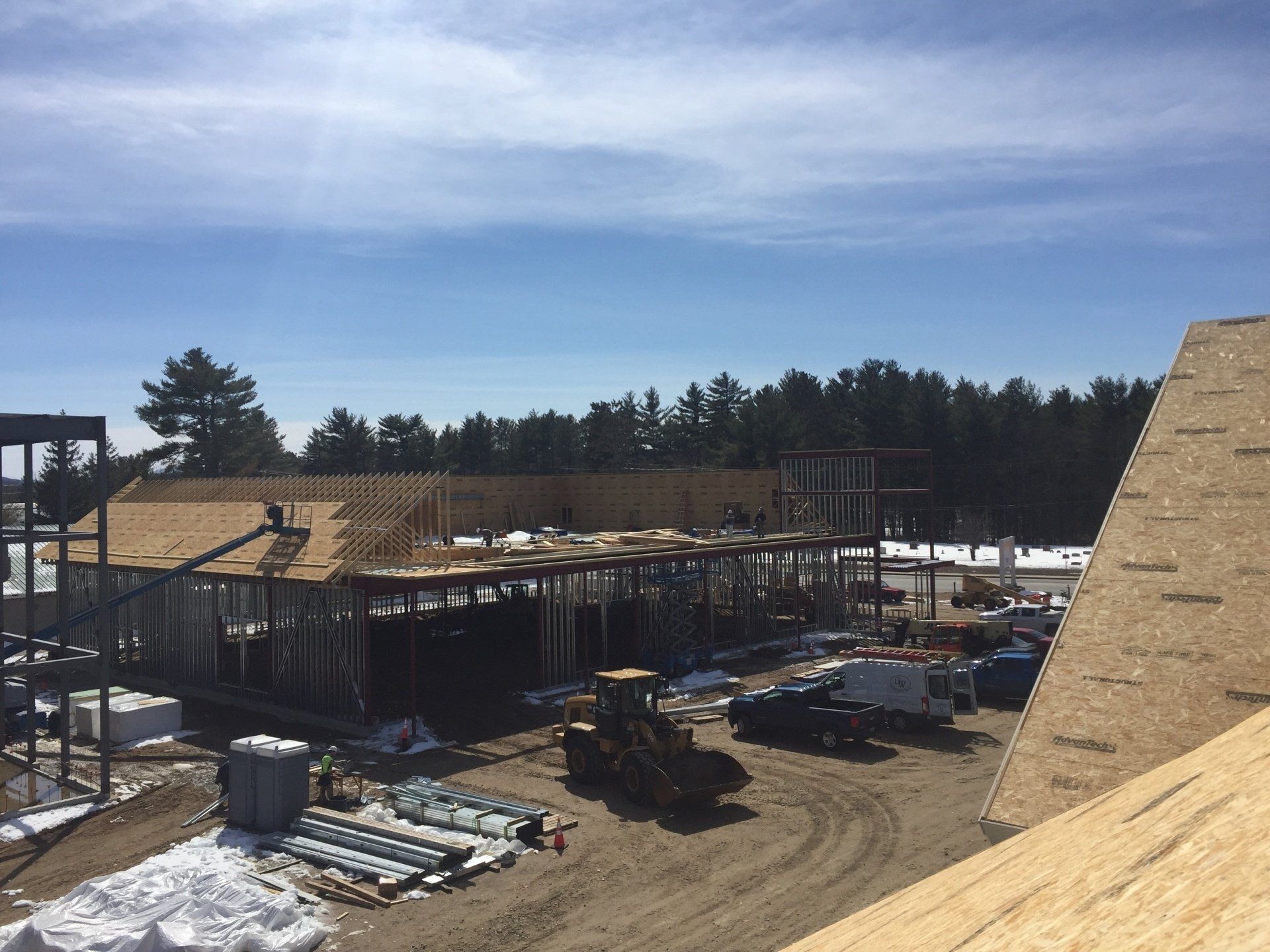 A construction site with a tractor in the middle of it