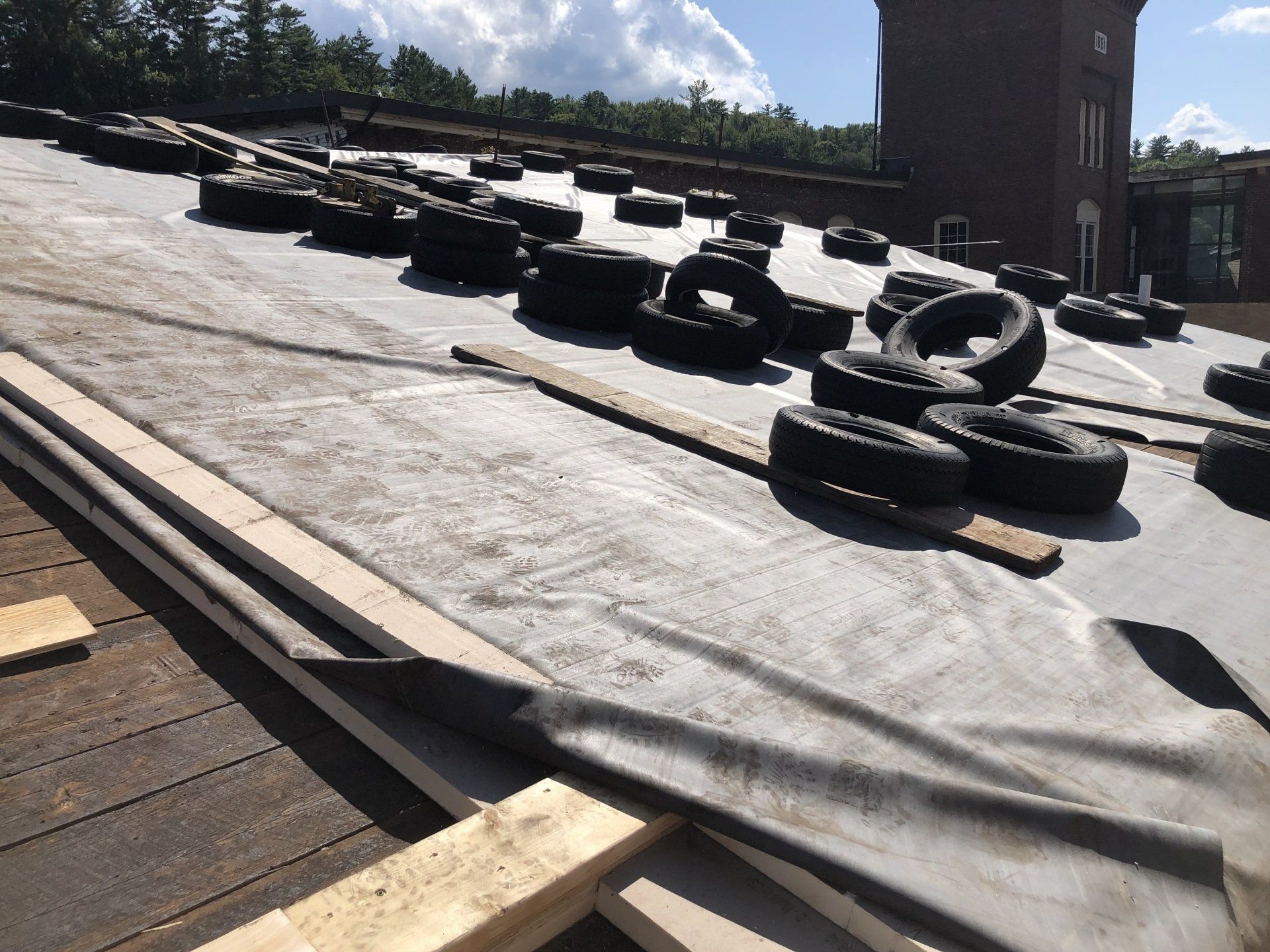 Rodd Roofing employees installing a single-ply roof in New Hampshire