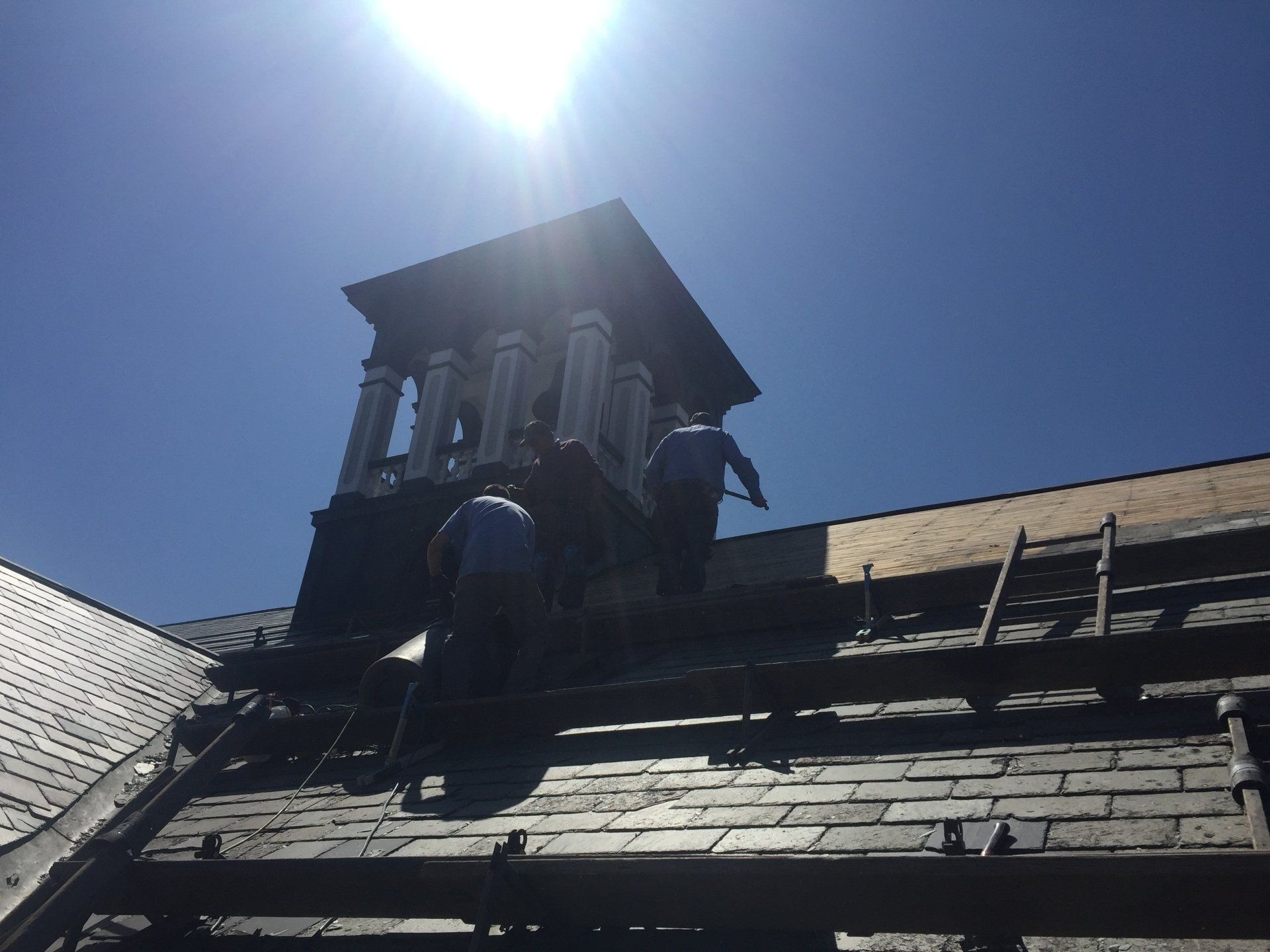 Rodd Roofing employees removing an old roof from a commercial  building