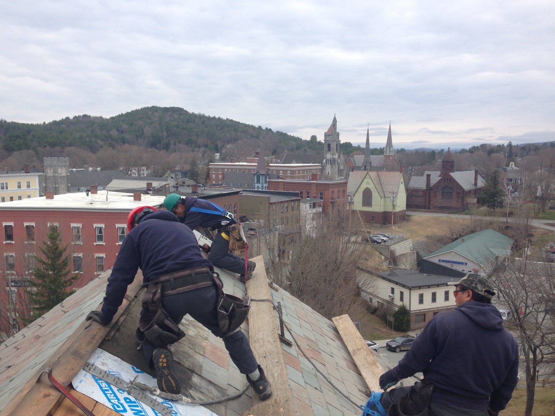 Rodd Roofing employees removing an old commercial roof