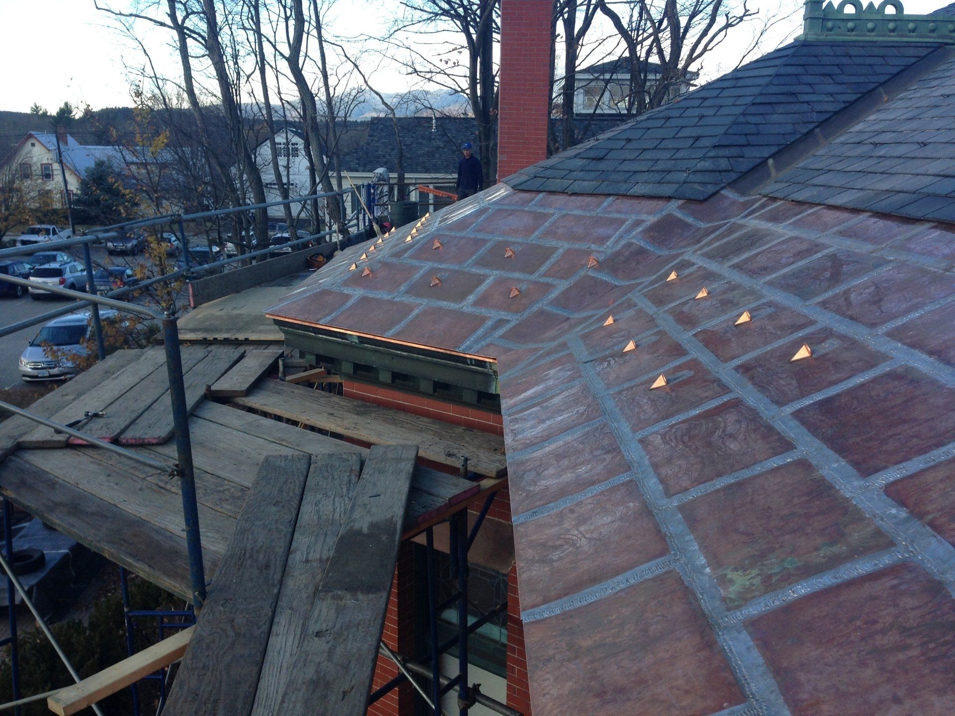 A brick roof with a chimney on top of it