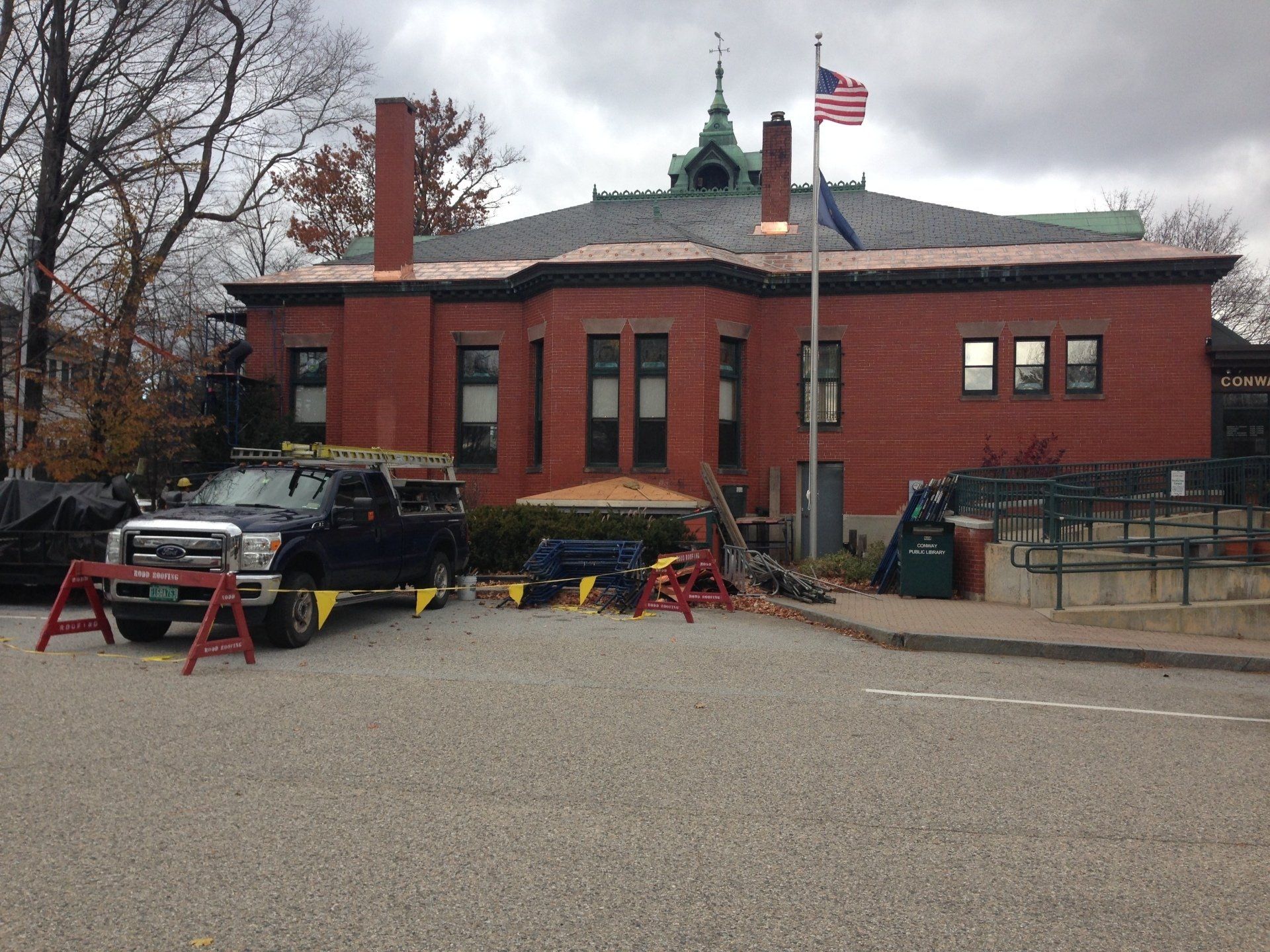 A Brick Building with cooper trimmed roof