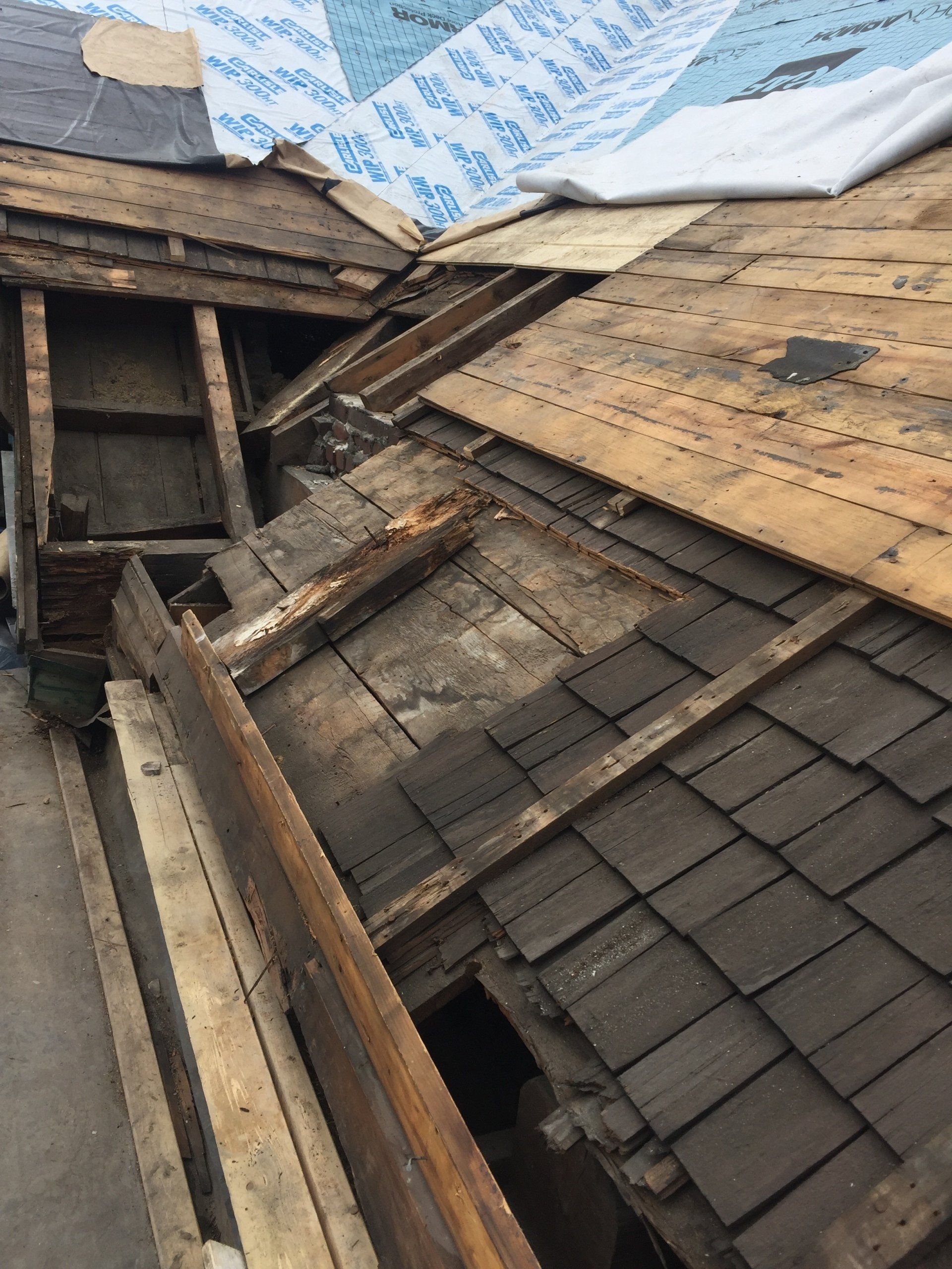 A wooden roof with a lot of pieces of wood on it