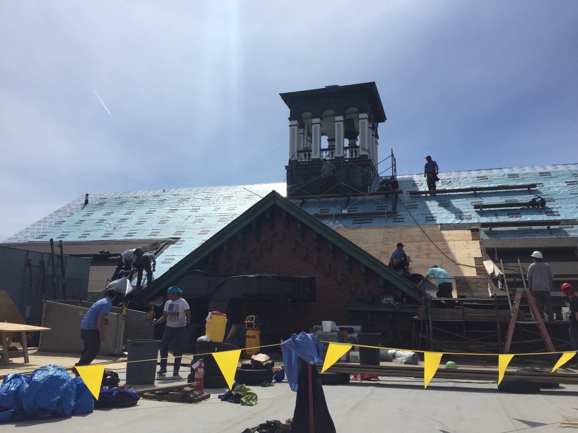Rodd Roofing employees prepping a commercial roof getting it ready for a new slate roof