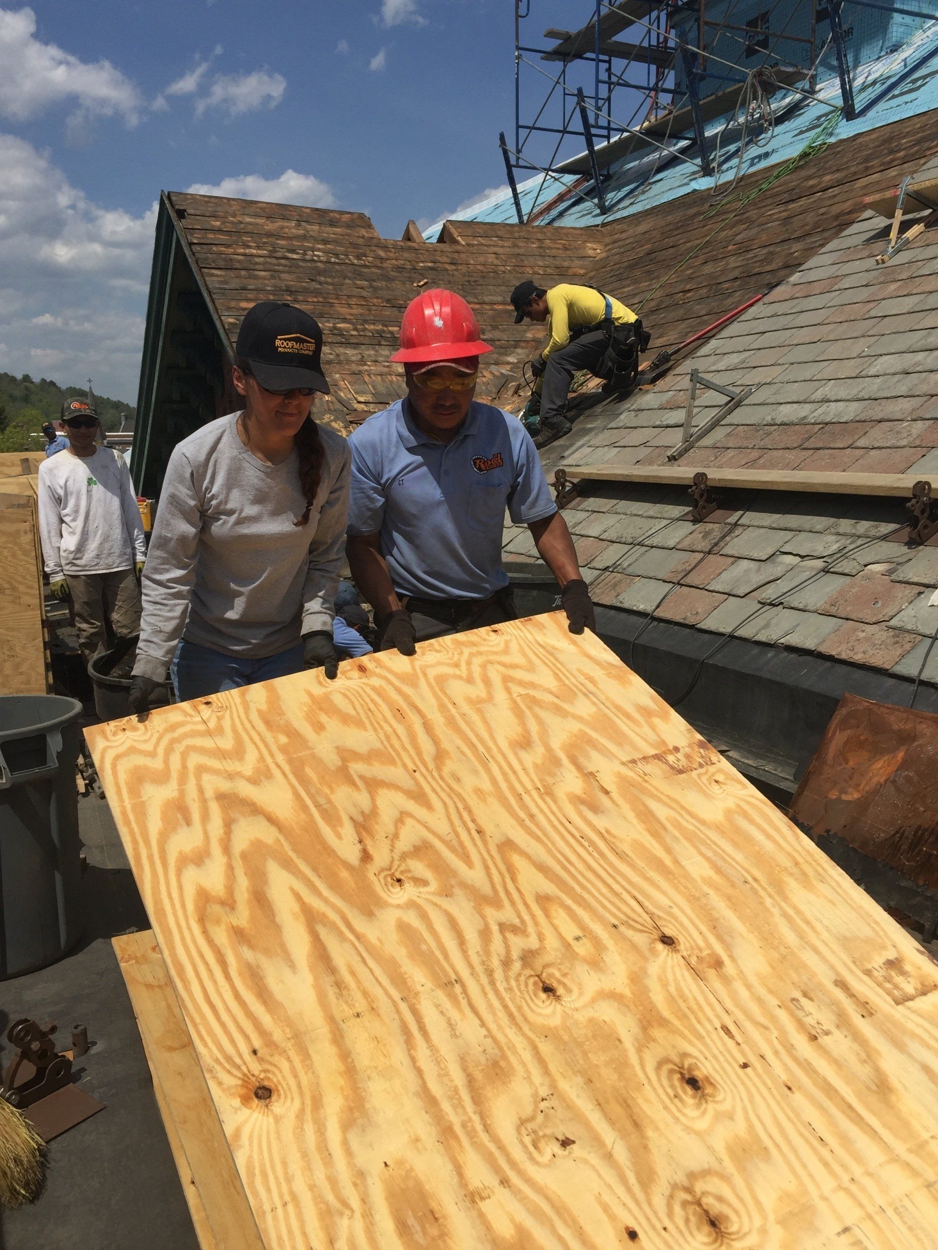 Rodd Roofing employees preparing a commercial roof  for a slate roof