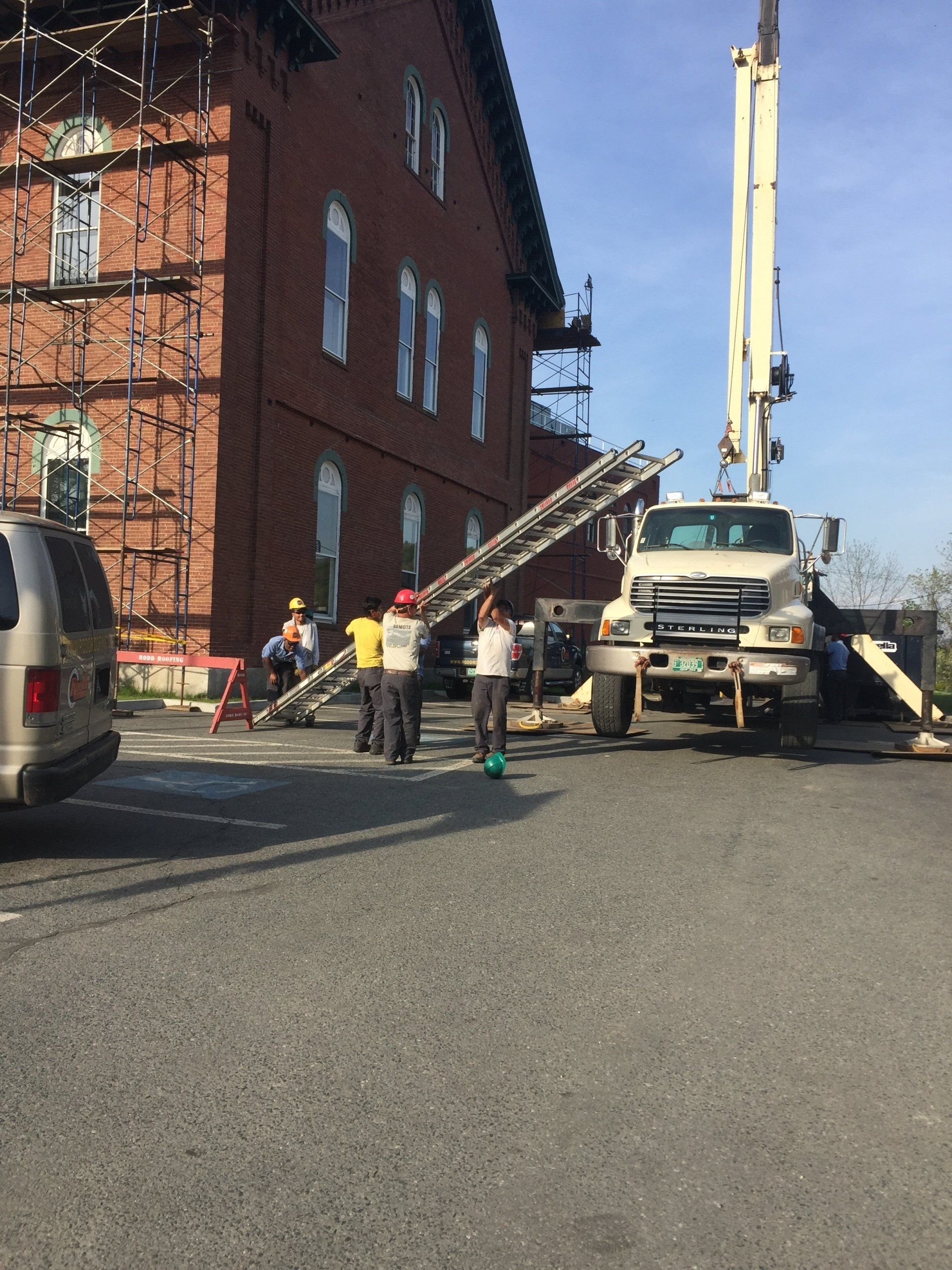 Rodd Roofing preparing a commercial roof  for a slate roof using their crane truck