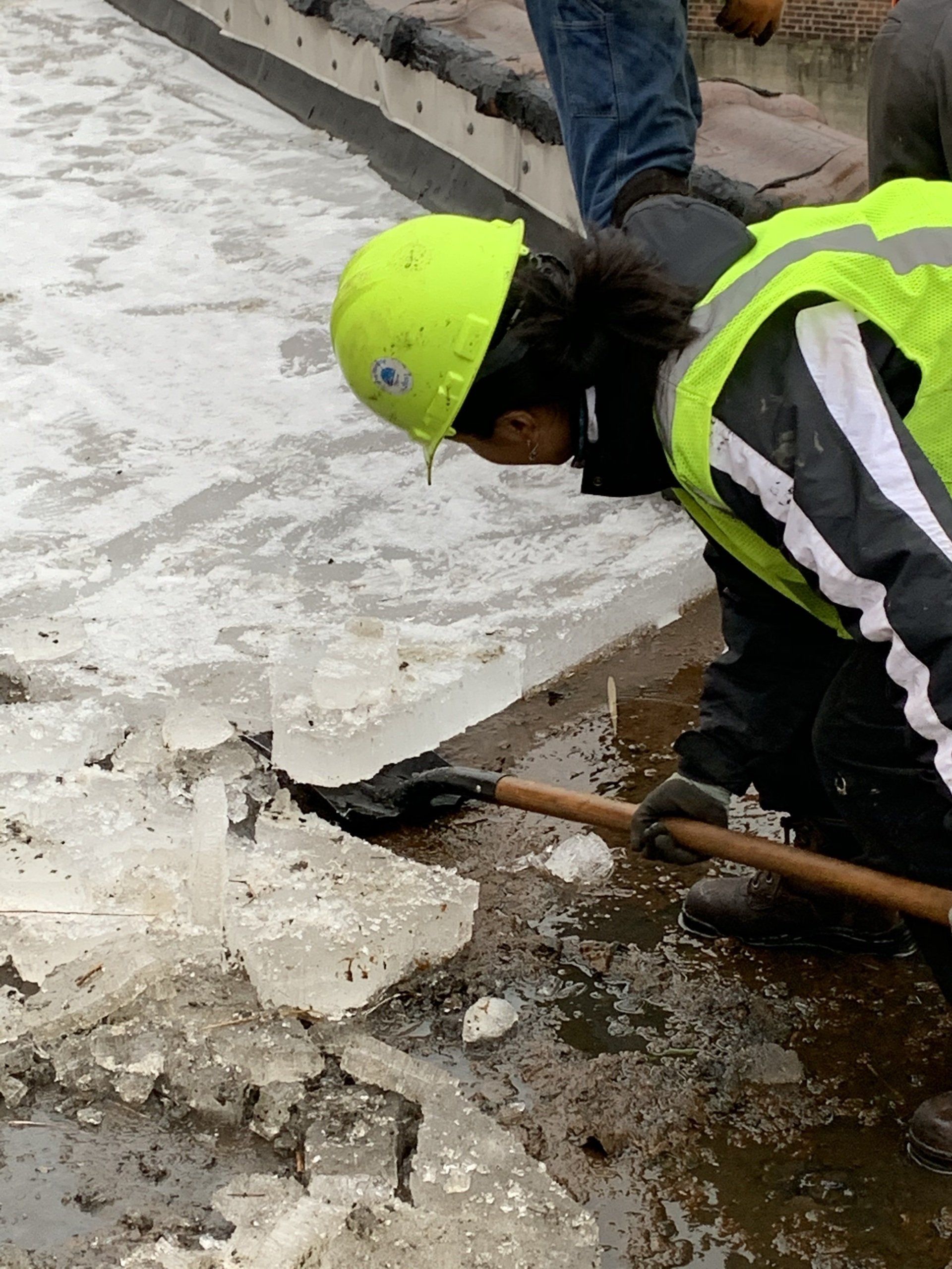 Rodd Roofing employees removing ice build up