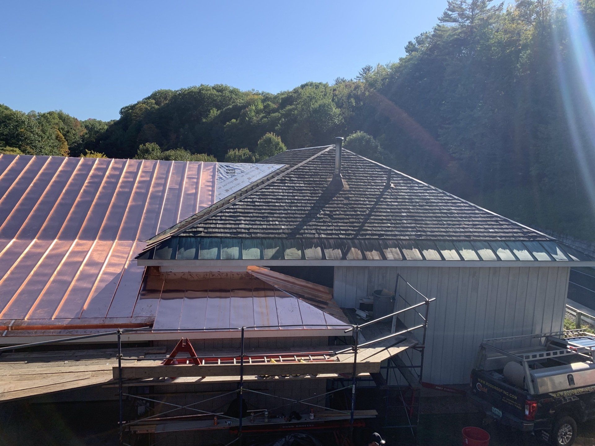 A copper roof is being installed on a house