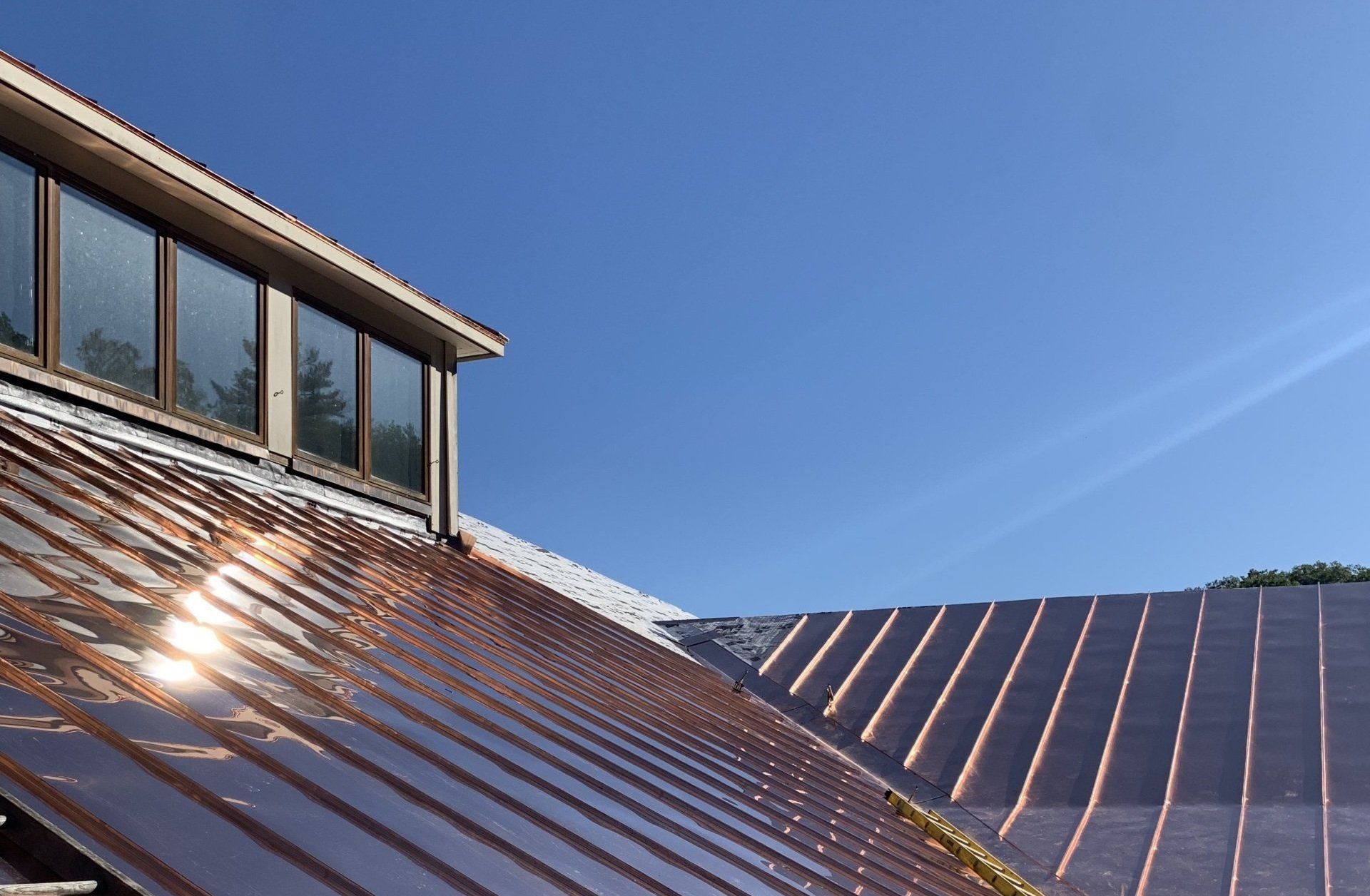 Sun shines on a copper roof in Vermont