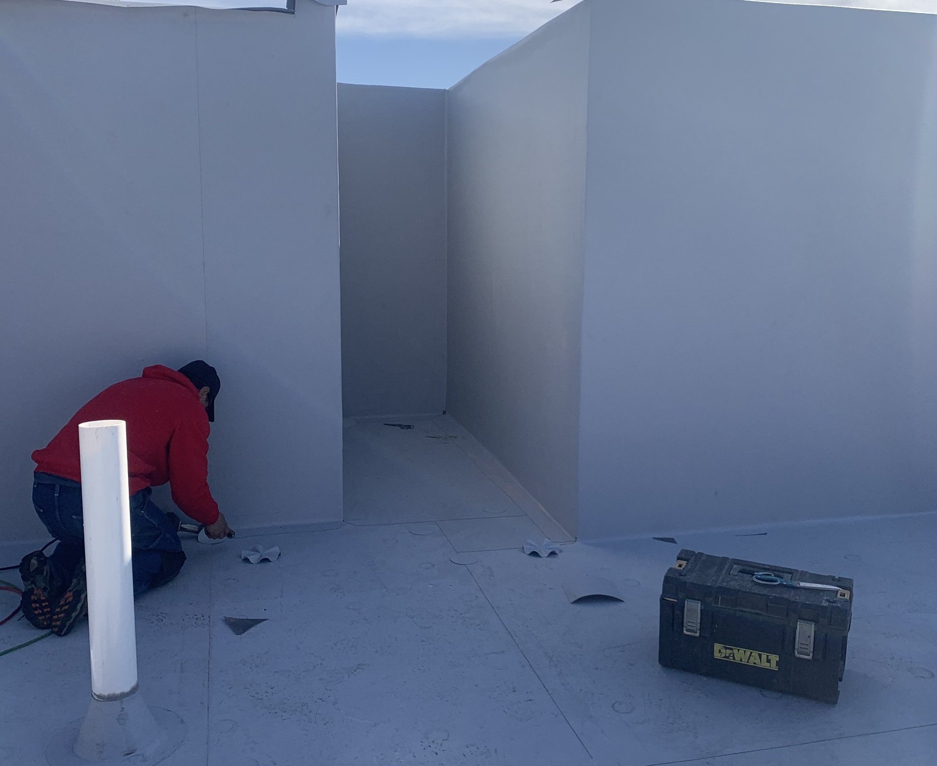 Rodd Roofing employee working on a single ply roof