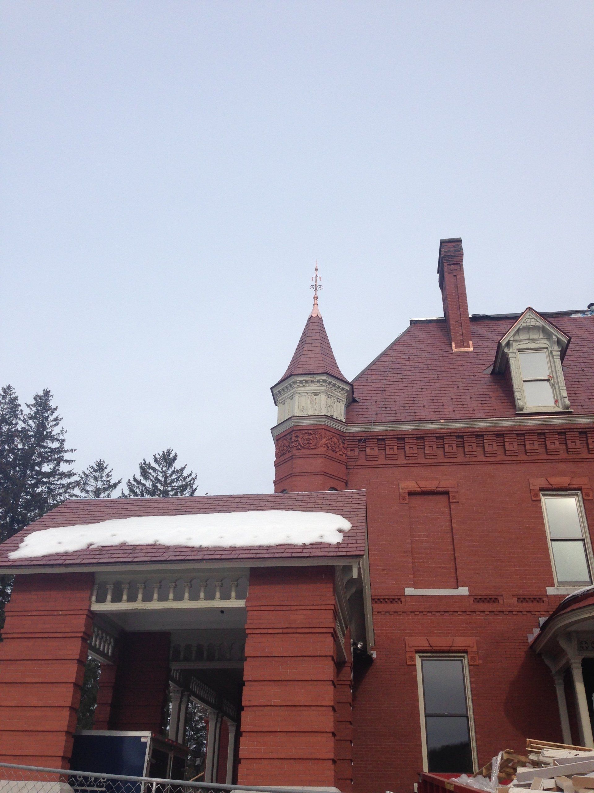 A red brick building with a tower on top of it