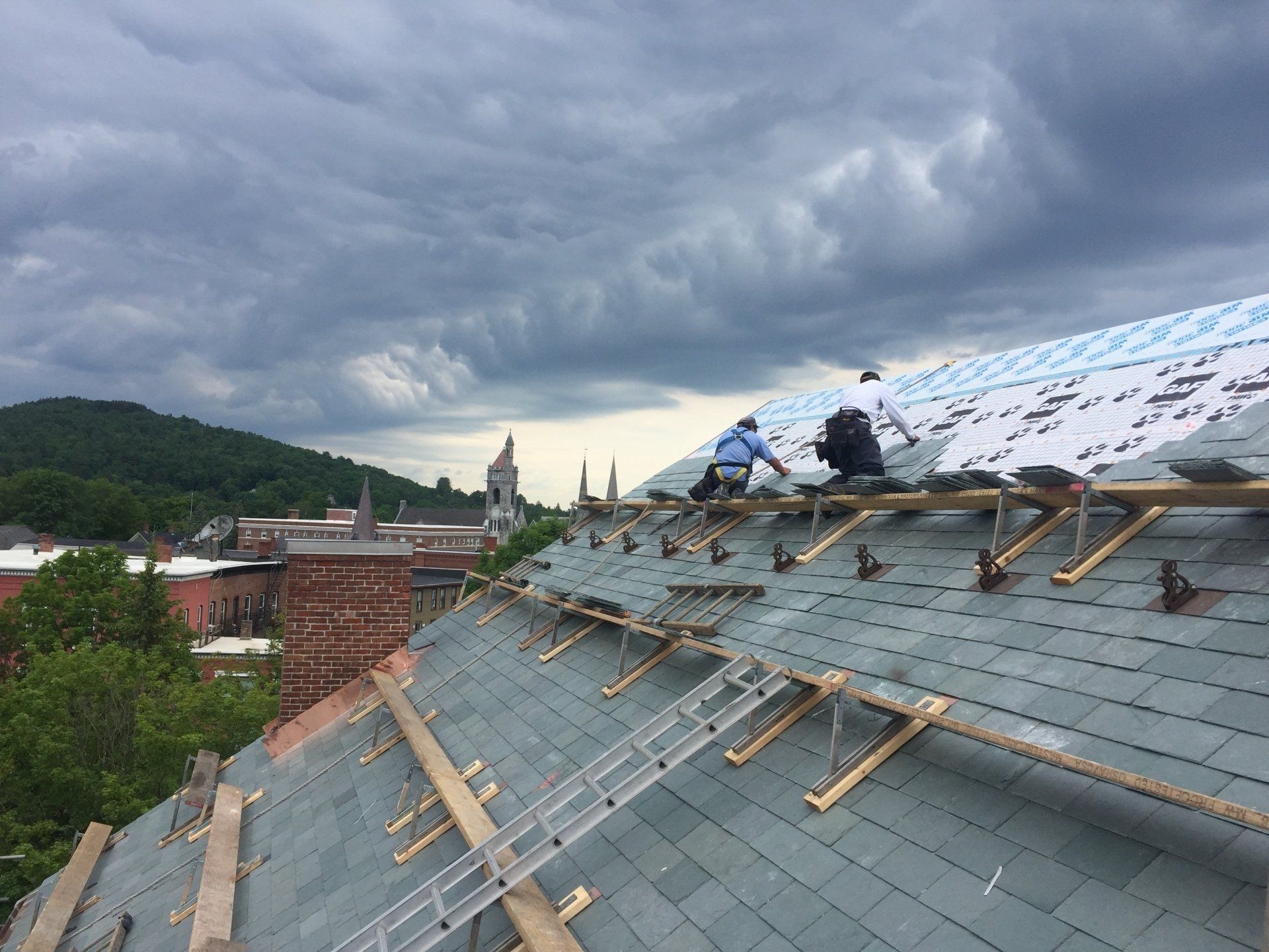 Rodd Roofing employees installing a slate roof