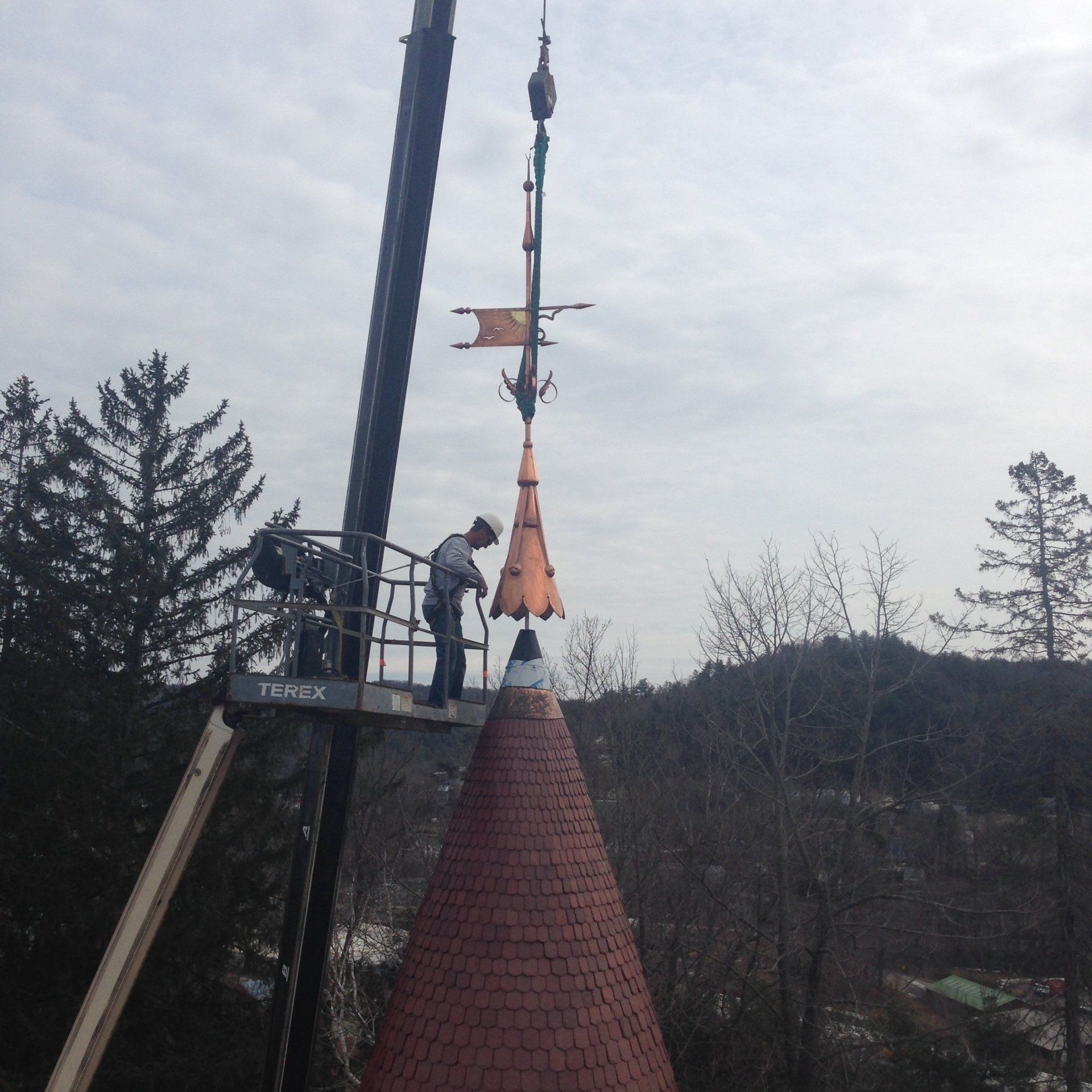 Rodd Roofing installing a decorative roof cap for a high school in Vermont