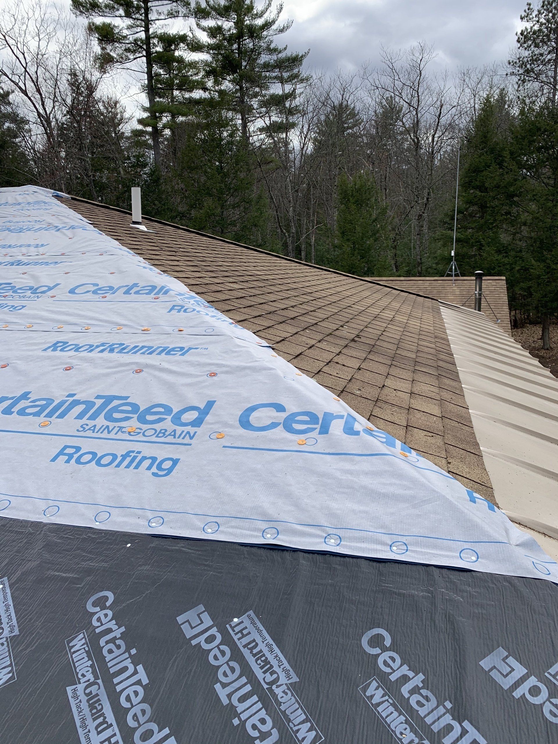 Rodd Roofing; Asphalt roof on a residential home.