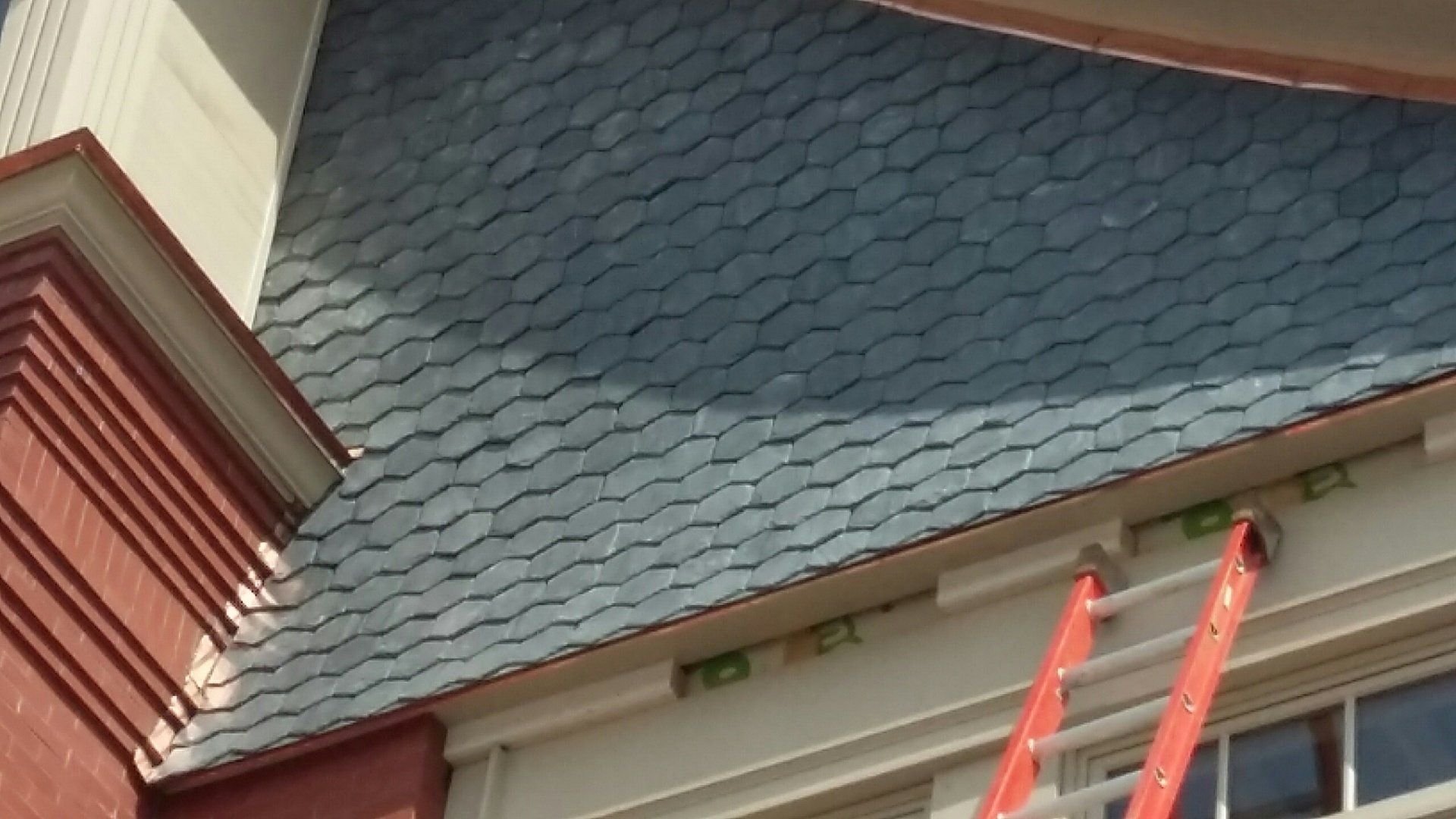 A ladder is attached to the side of a building