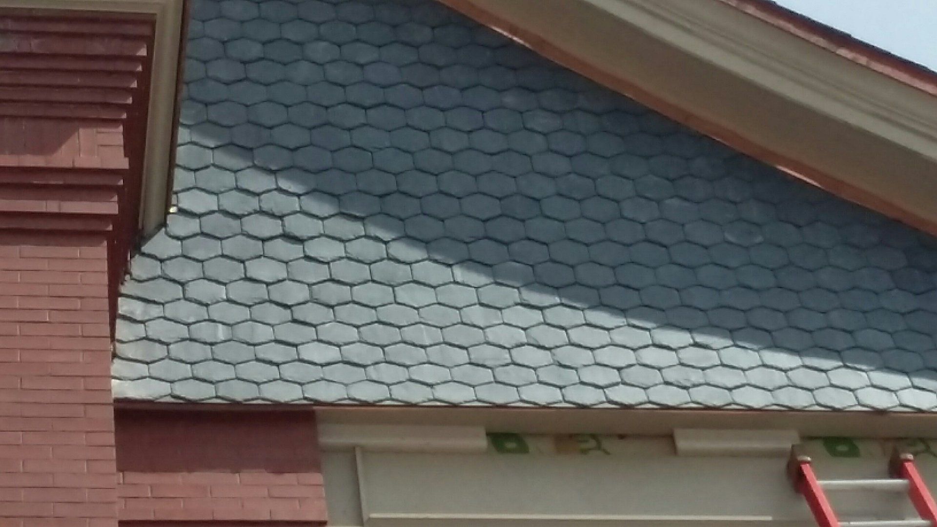 A house with a ladder on the side of it