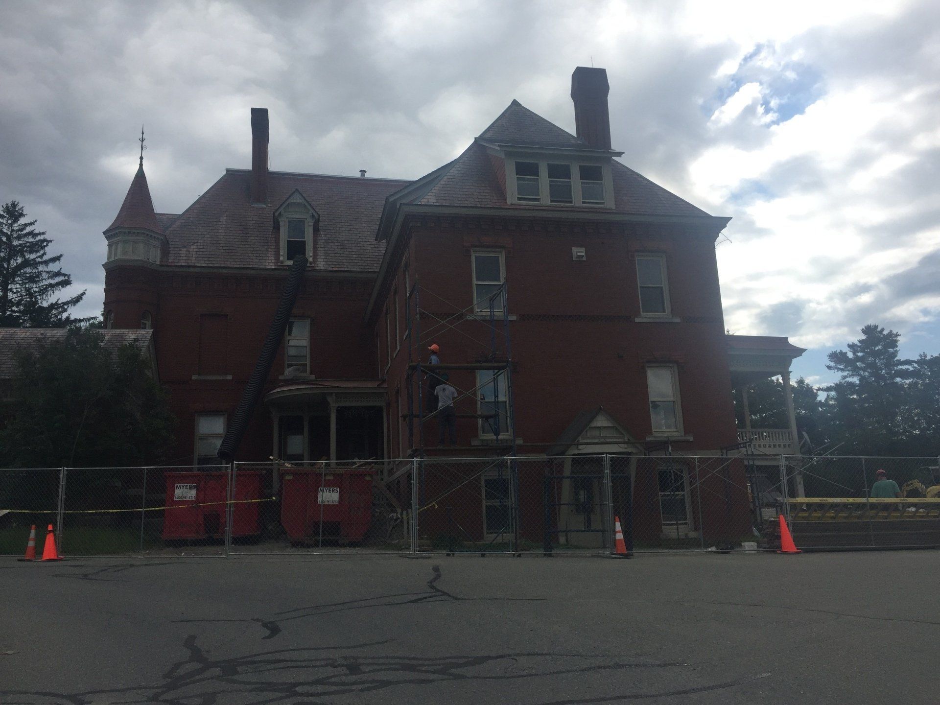 A large brick building with a fire escape on the side of it