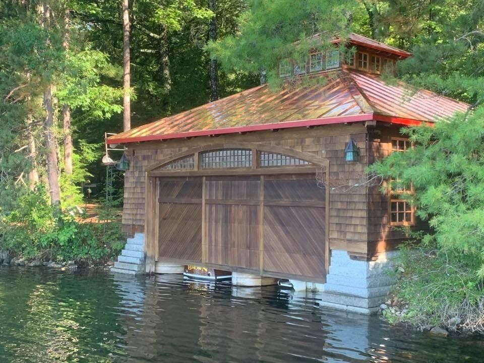 A boat shed with a copper roof installed by Rodd Roofing in New Hampshire