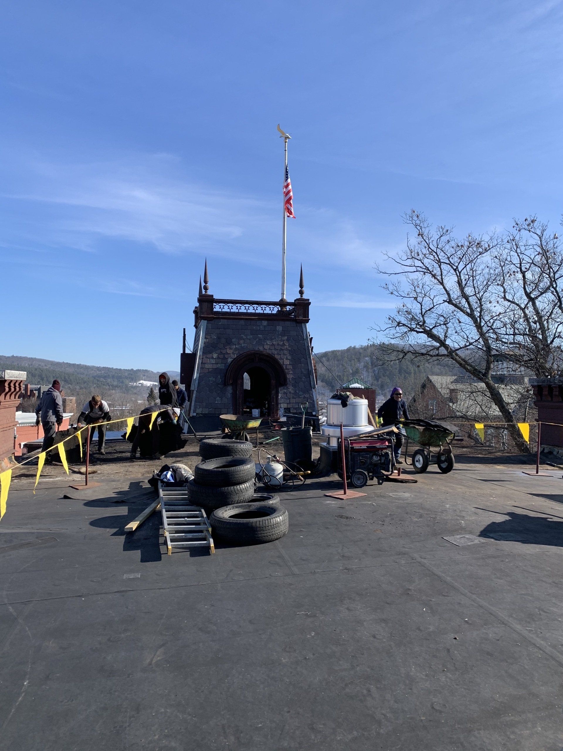 Rodd Roofing employees preparing a commercial roof for a new single-ply intallation