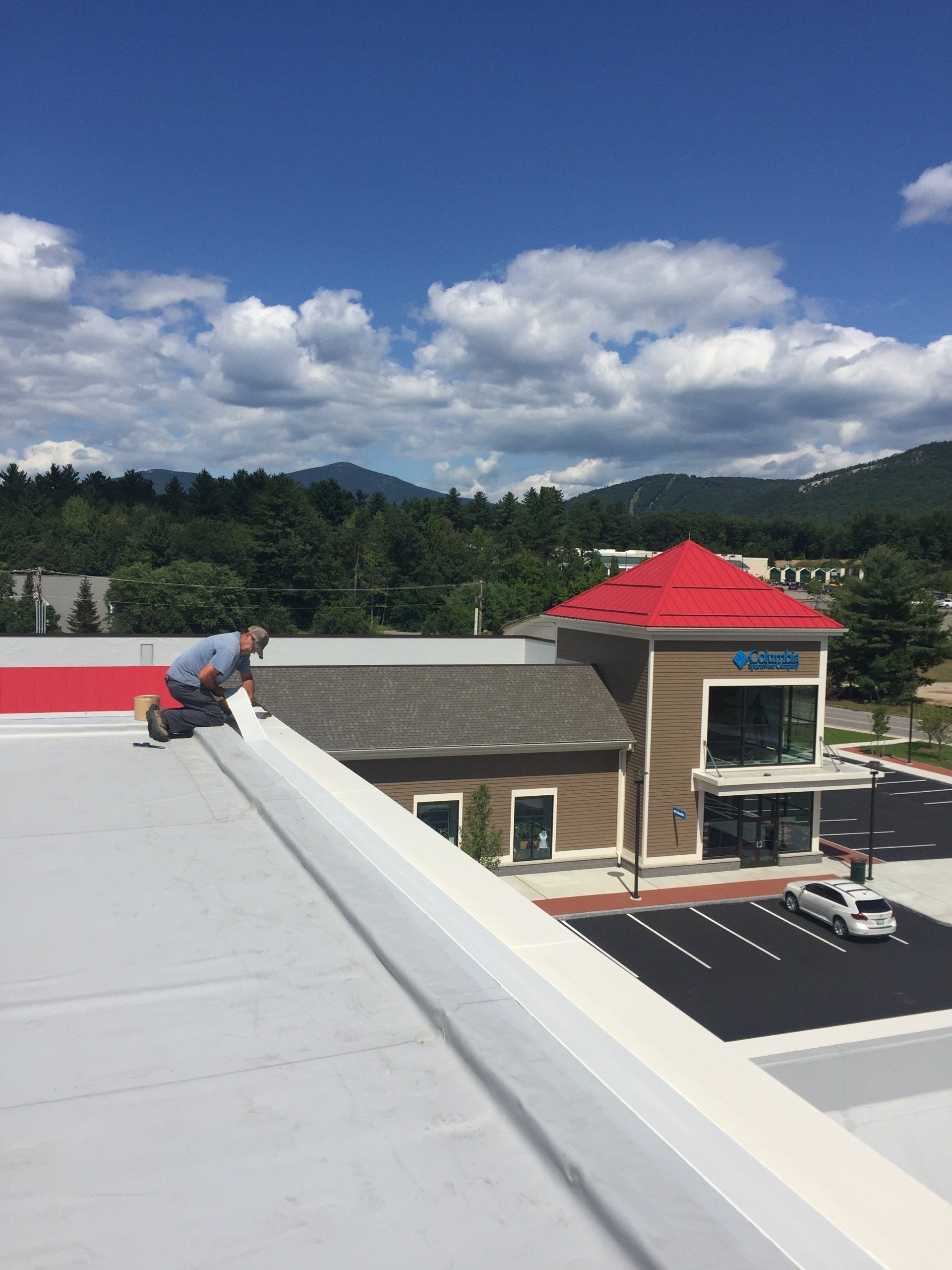 man working on a commercial roof