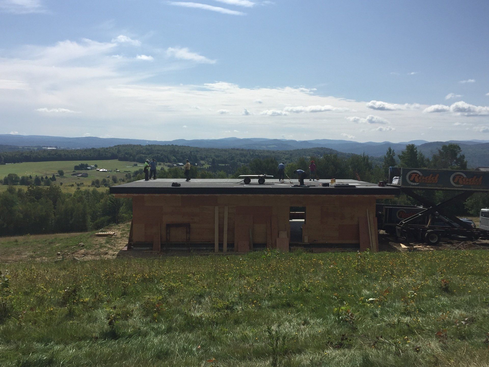 Rodd Roofing installing a single ply roof on a residential roof