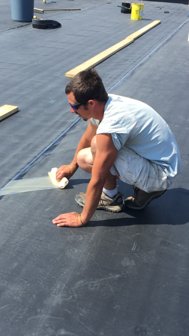 Rodd Roofing: an employee preparing a commercial roof
