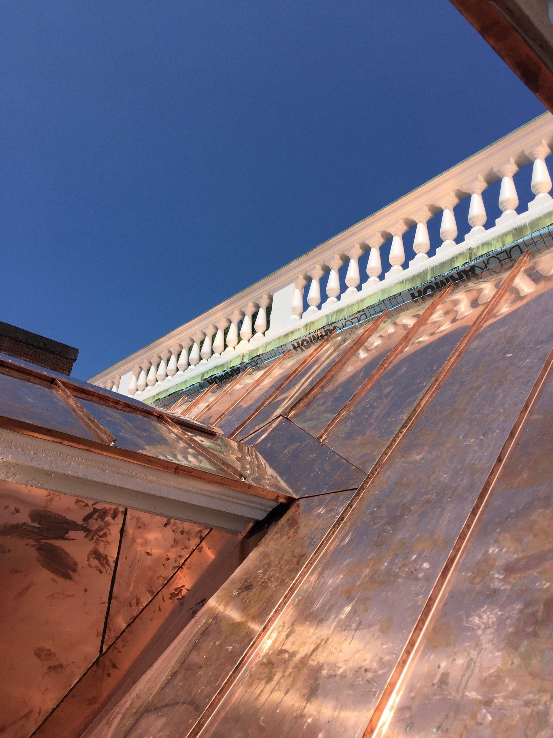 A copper roof on a commercial budling