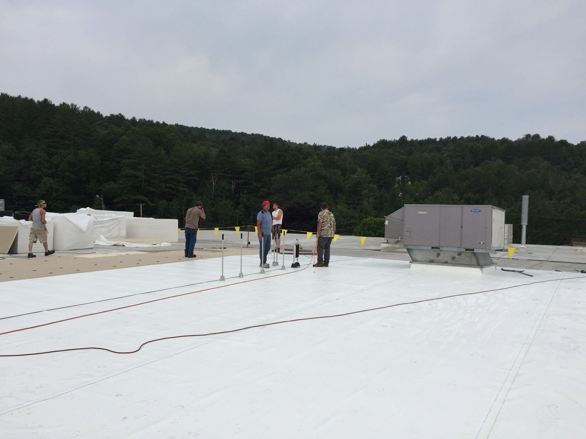 Rood Roofing installing a single ply roof on Fairbanks Sales in Vermont