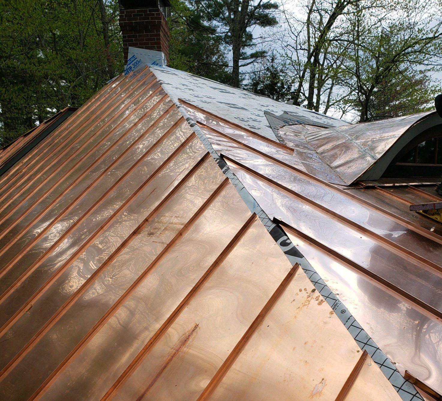 Vermont Roofing Company Rodd Roofing works to install a Copper Roof