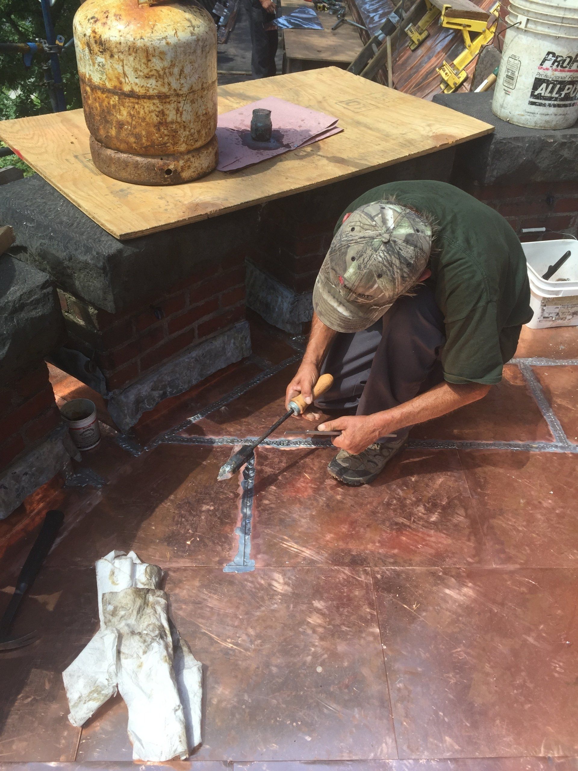 commercial roofing contractor in Vermont Working on a copper roof