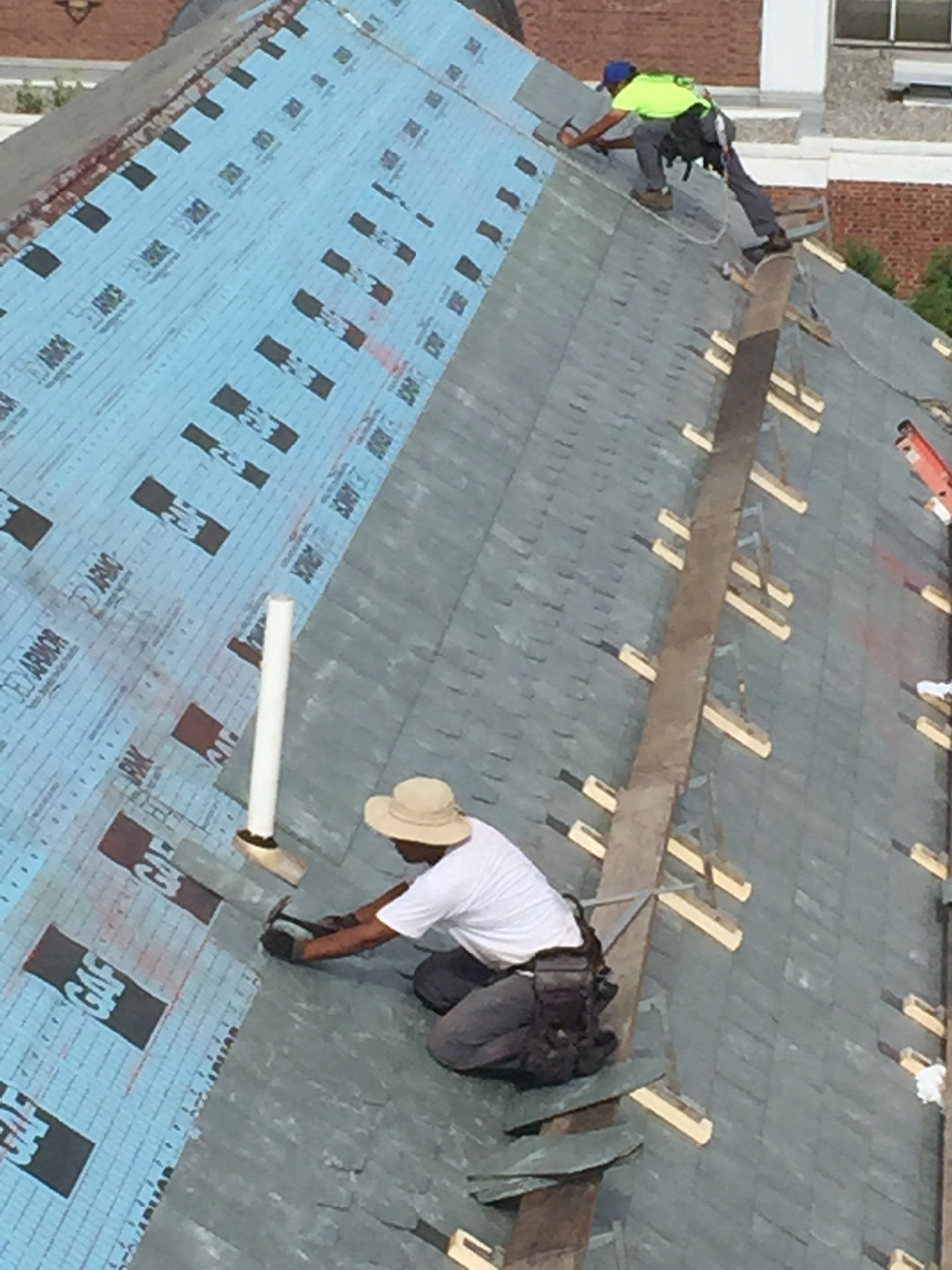 Rodd Roofing, a Vermont roofing contractor, installs a slate shingle roof in Burlington
