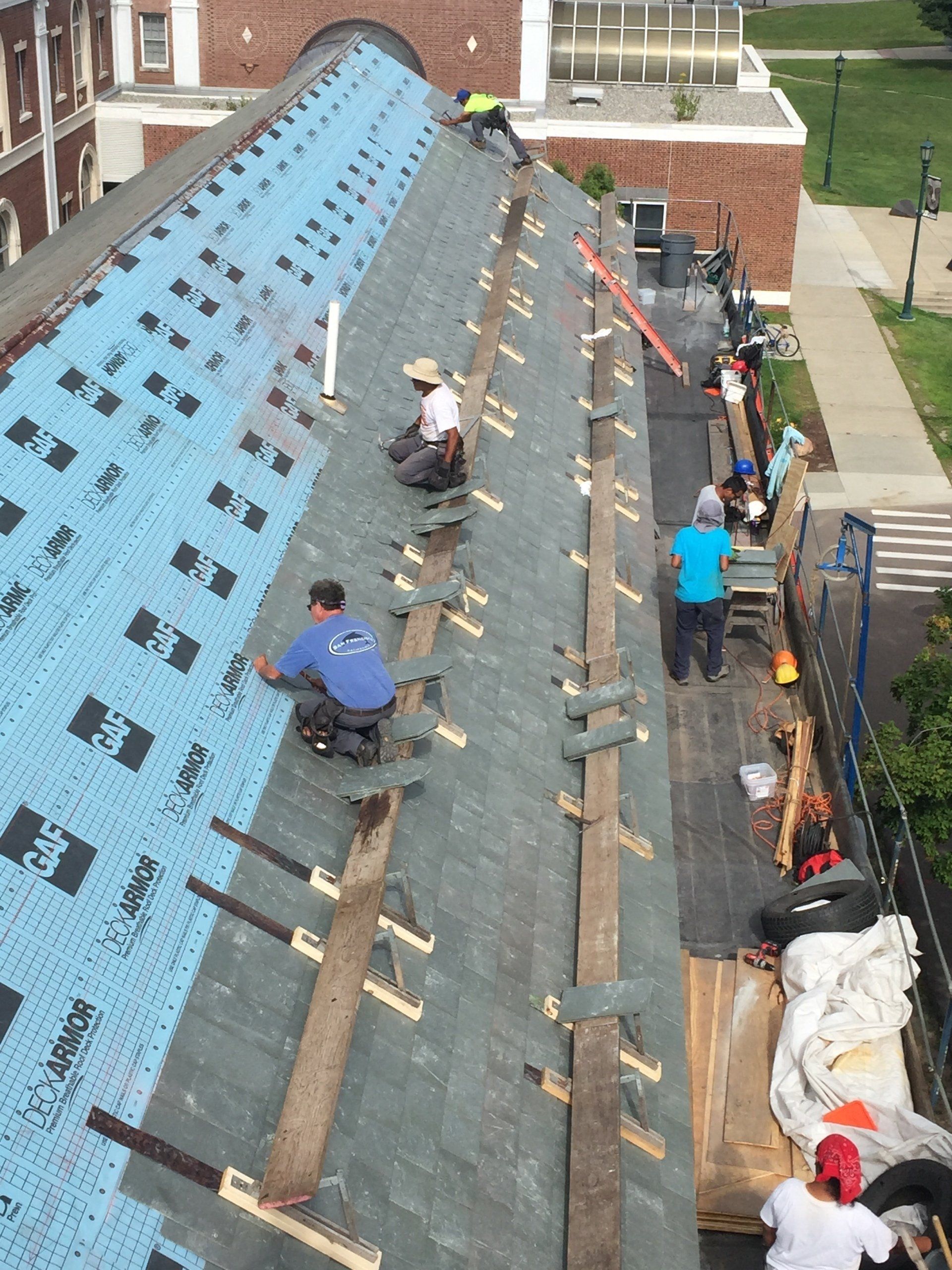 Vermont slate roofer company Rodd Roofing installs slate tile roofing on Perkins Hall in Burlington