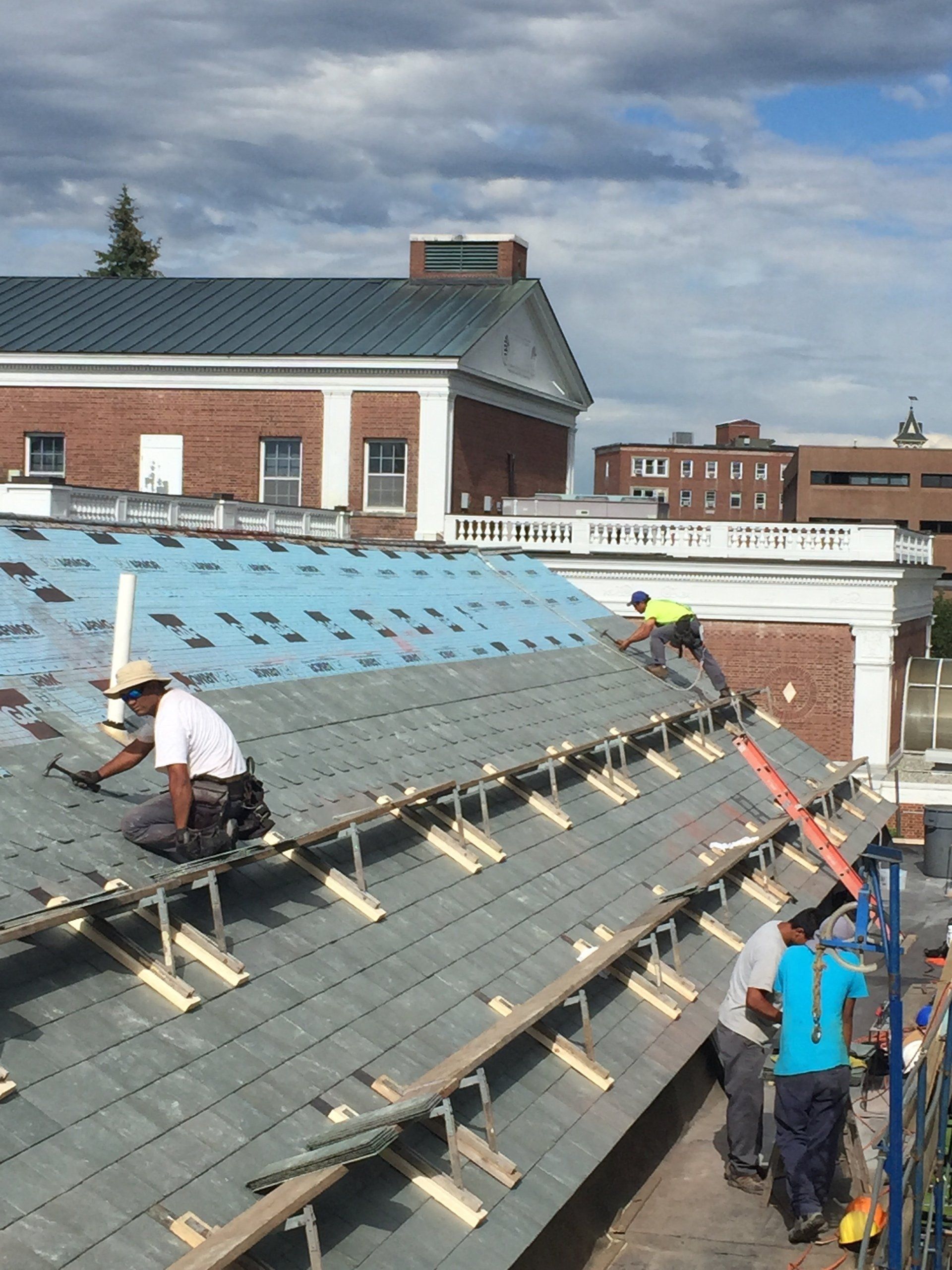 The Vermont Slate Roofing experts at Rodd Roofing install a slate shingle roof on Perkins Hall in Burlington