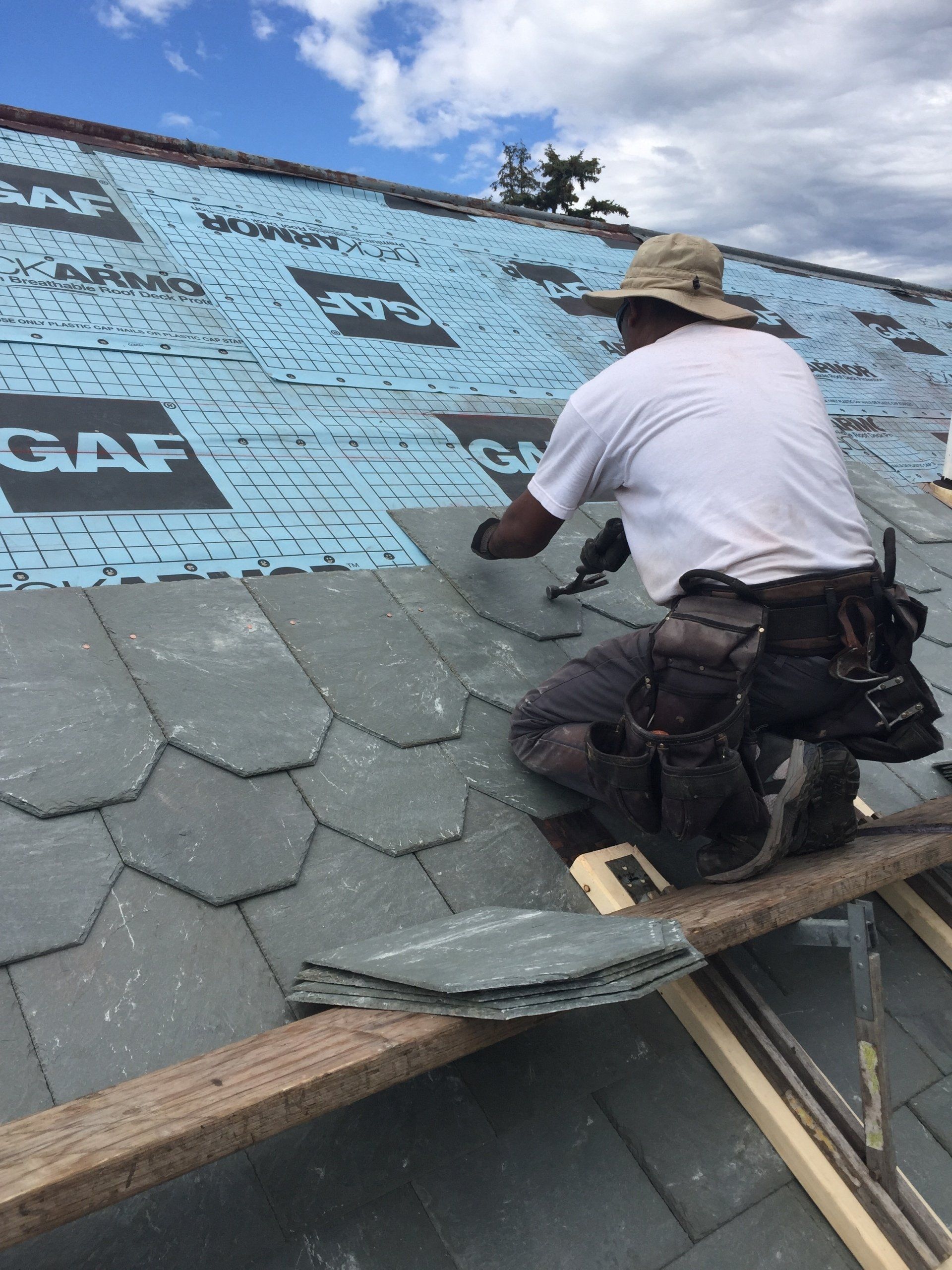 Vermont slate roofs experts from Rodd Roofing install a slate shingle roof in Burlington