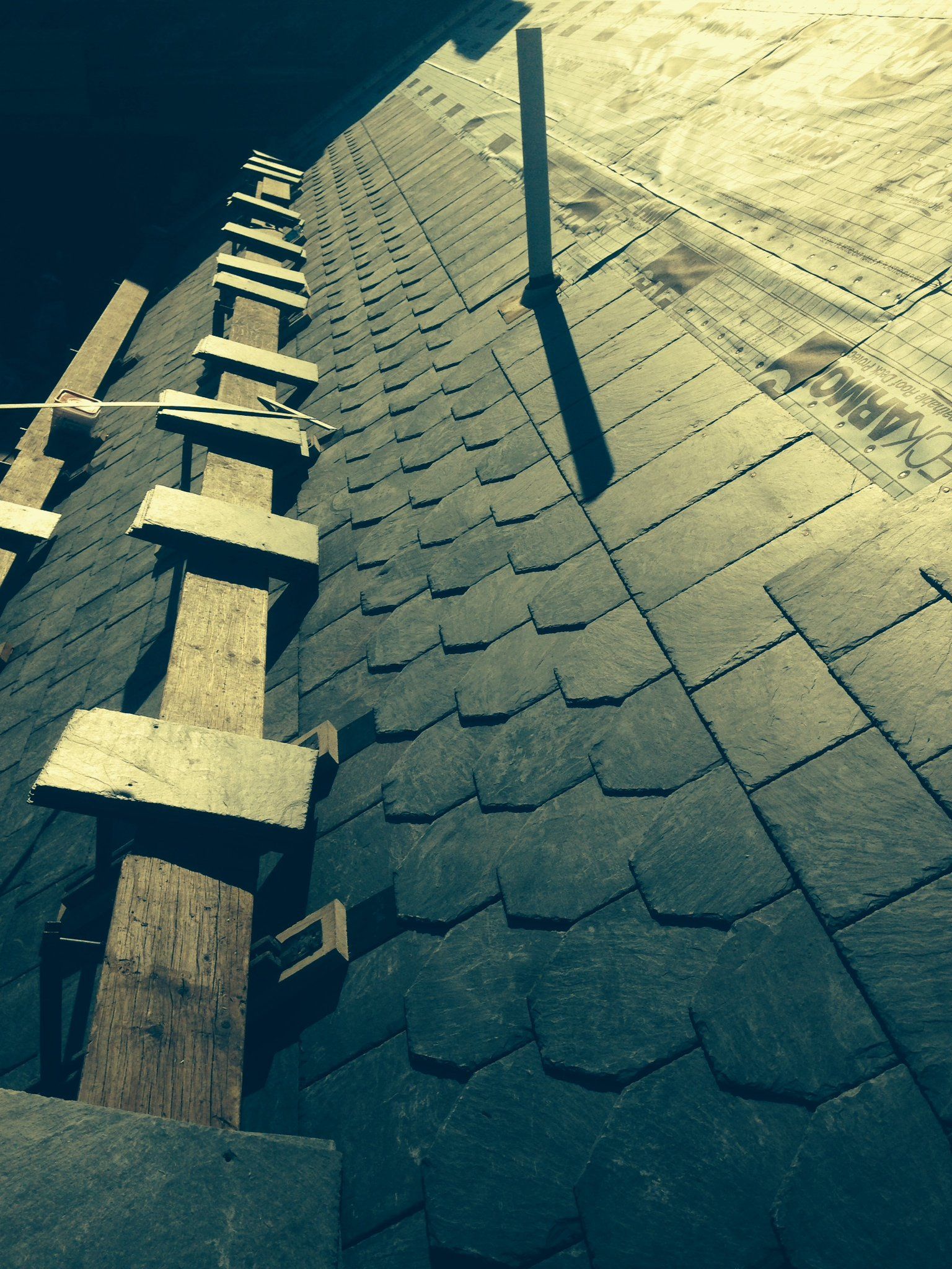 Expertly laid slate shingles on a commercial slate roof in Vermont