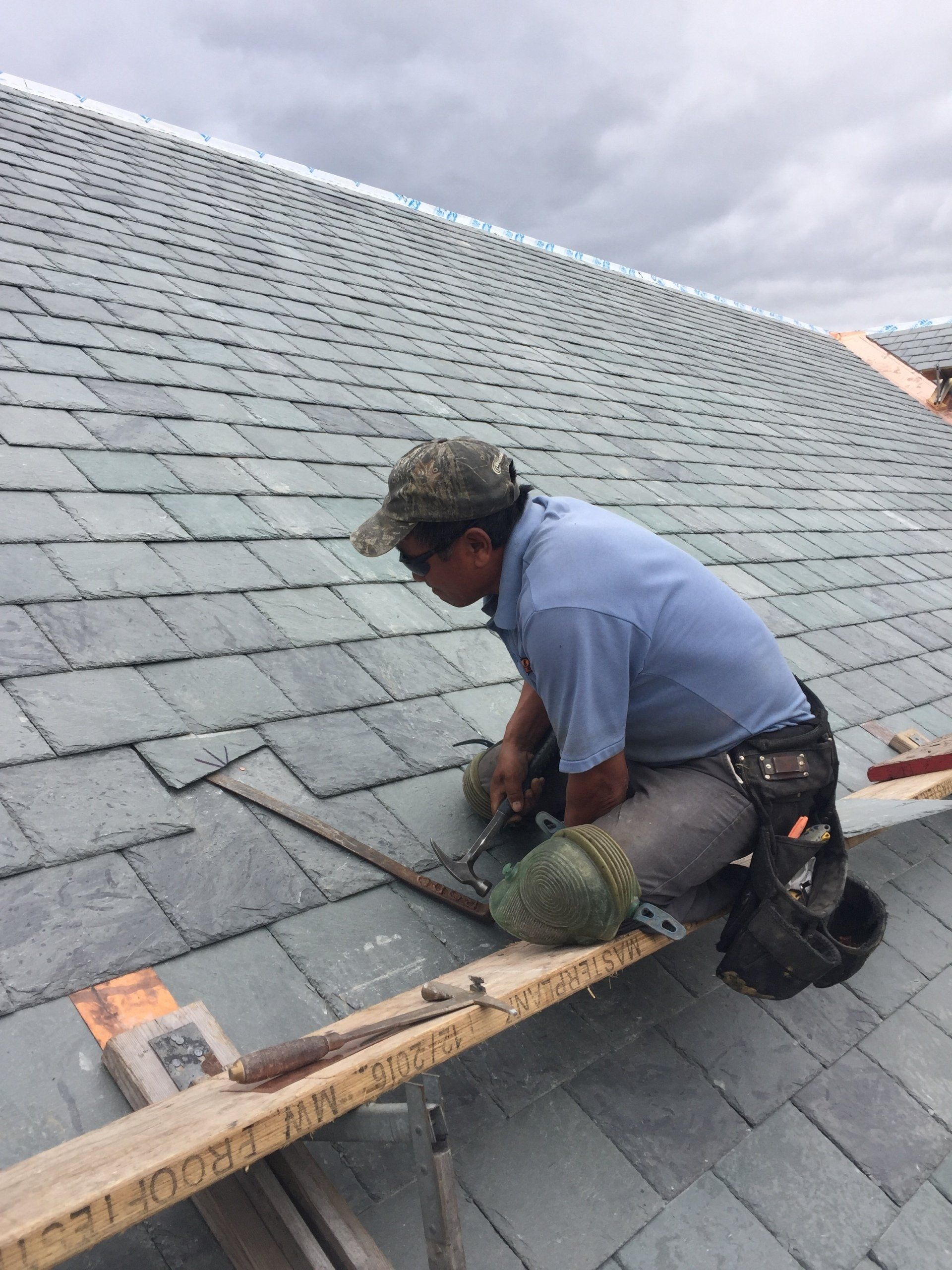 Rodd Roofing employees installing a slate roof
