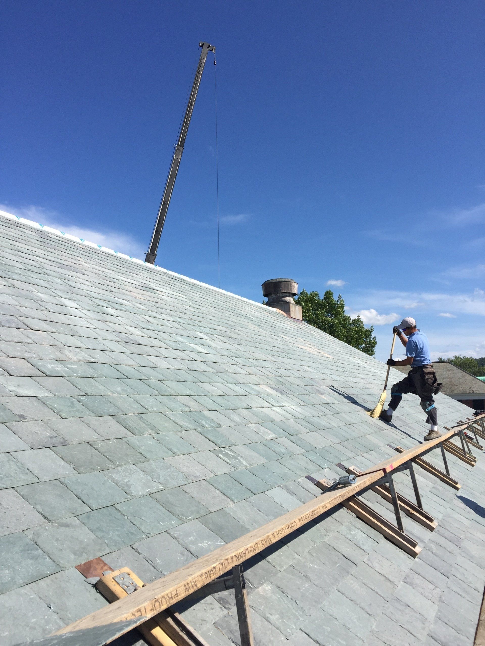Rodd Roofing employees installing a slate roof