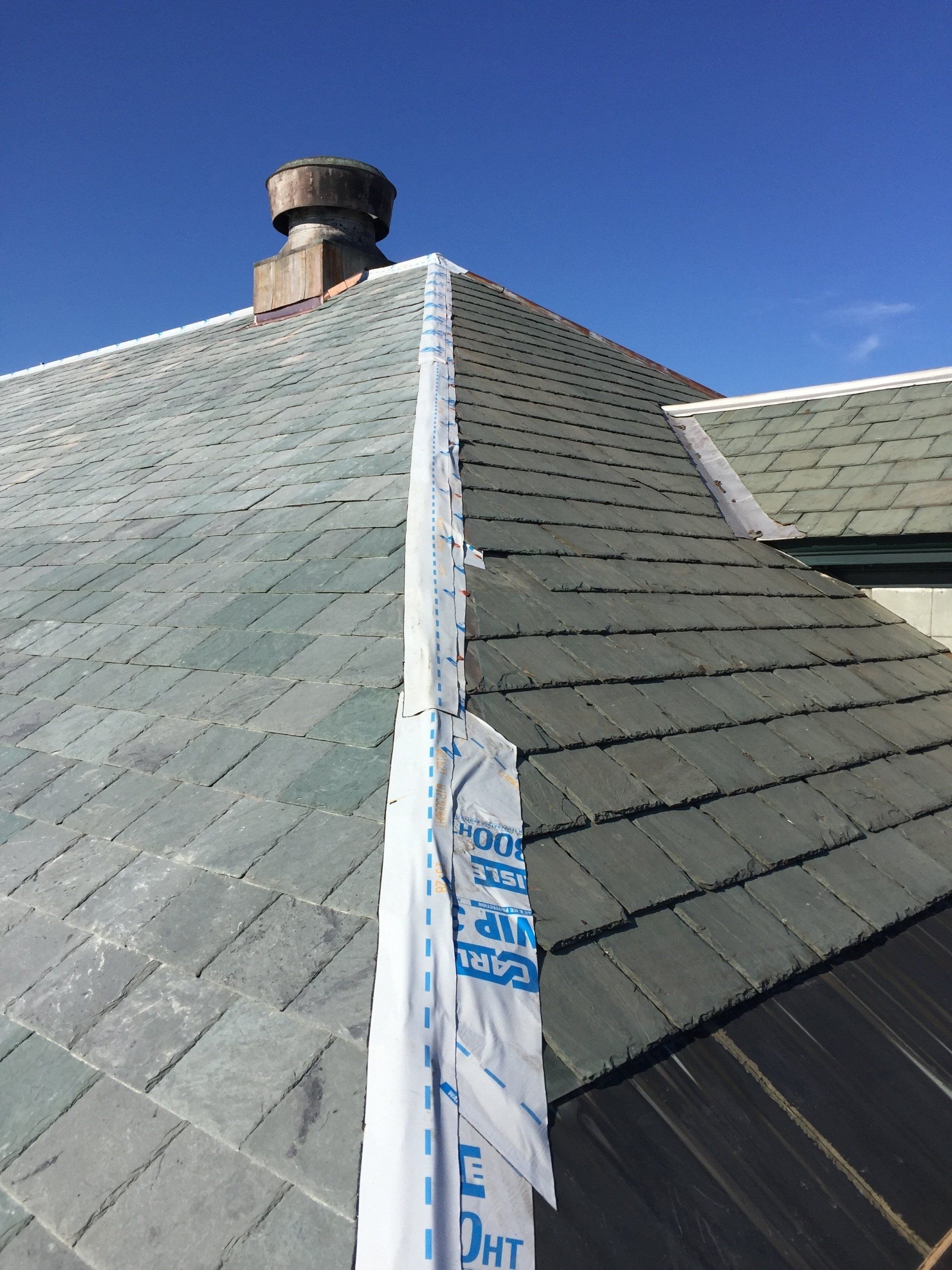 A roof with a chimney on top of it