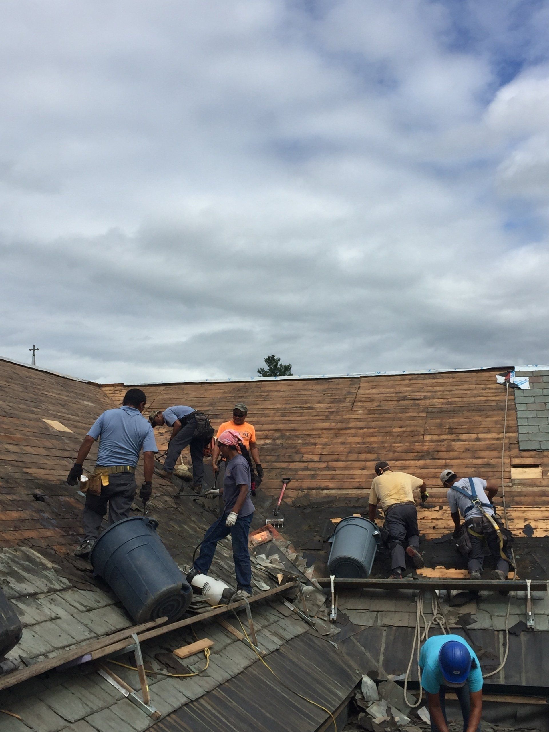 Rodd Roofing employees installing a slate roof