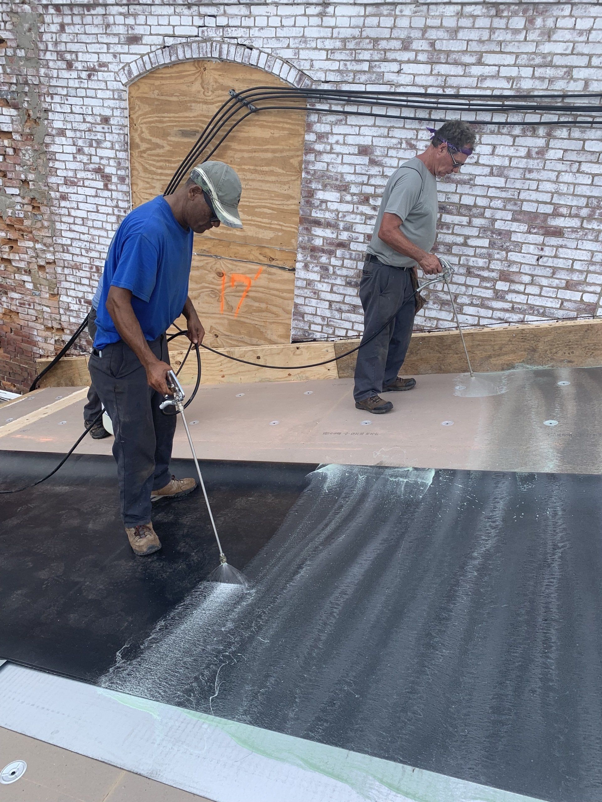 Rodd Roofing employees working on the River Mill single-ply roofing project New Hampshire
