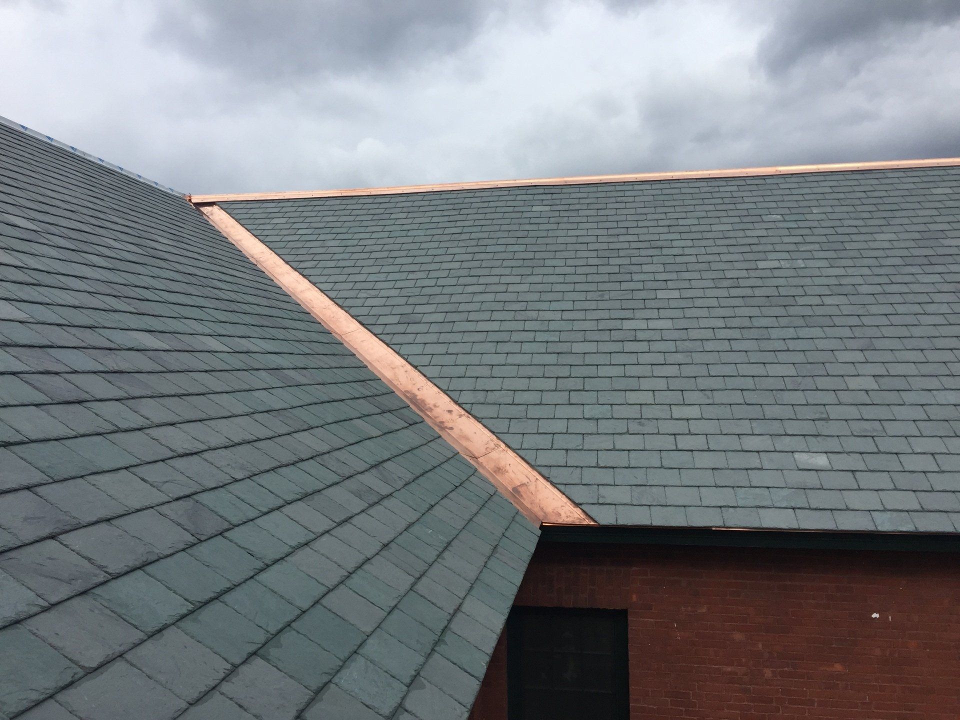 Rood Roofing finished a slate roofing with copper finishes