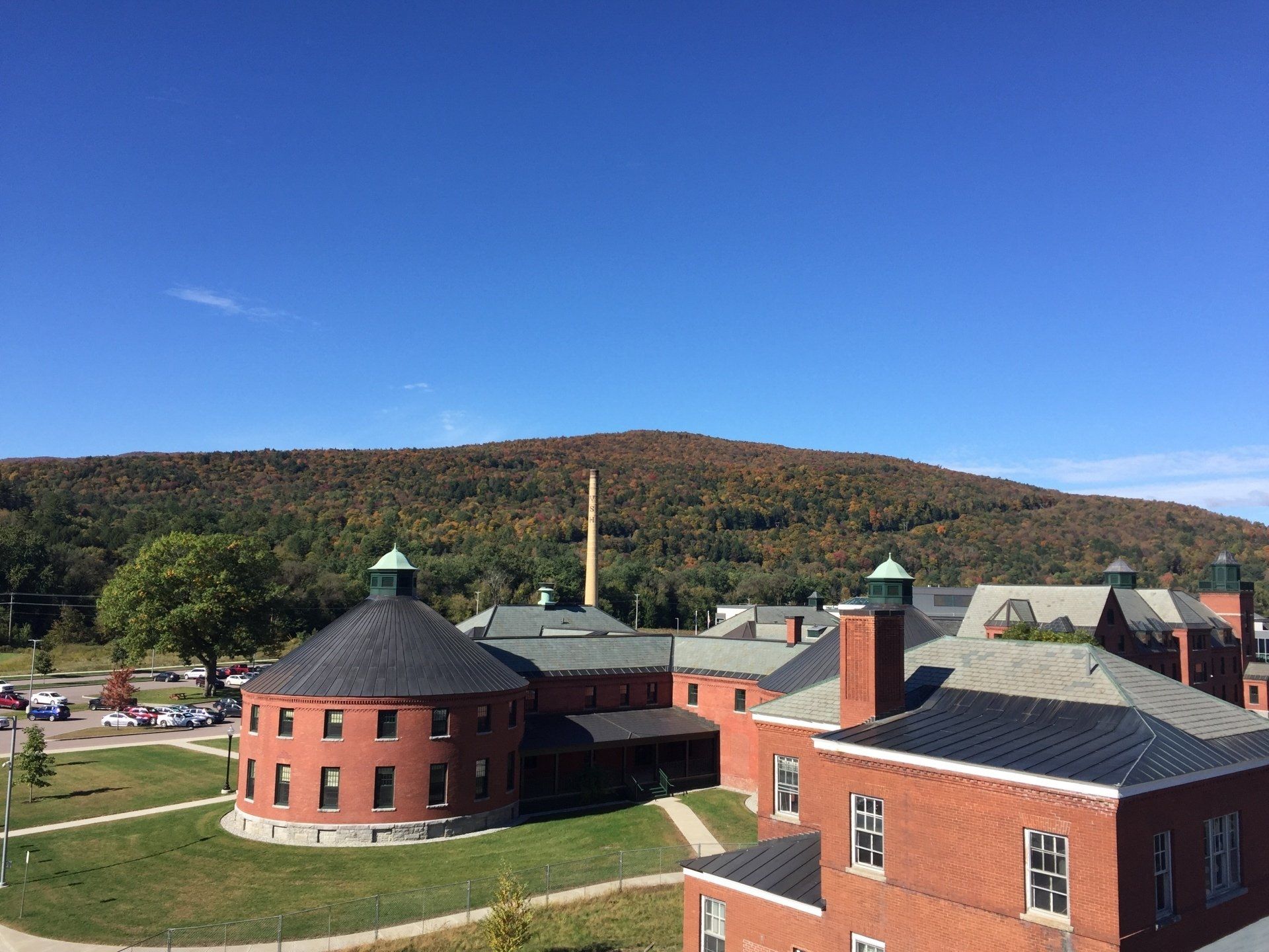 Areal view of the slate roof and brick building completed by Rodd Roofing