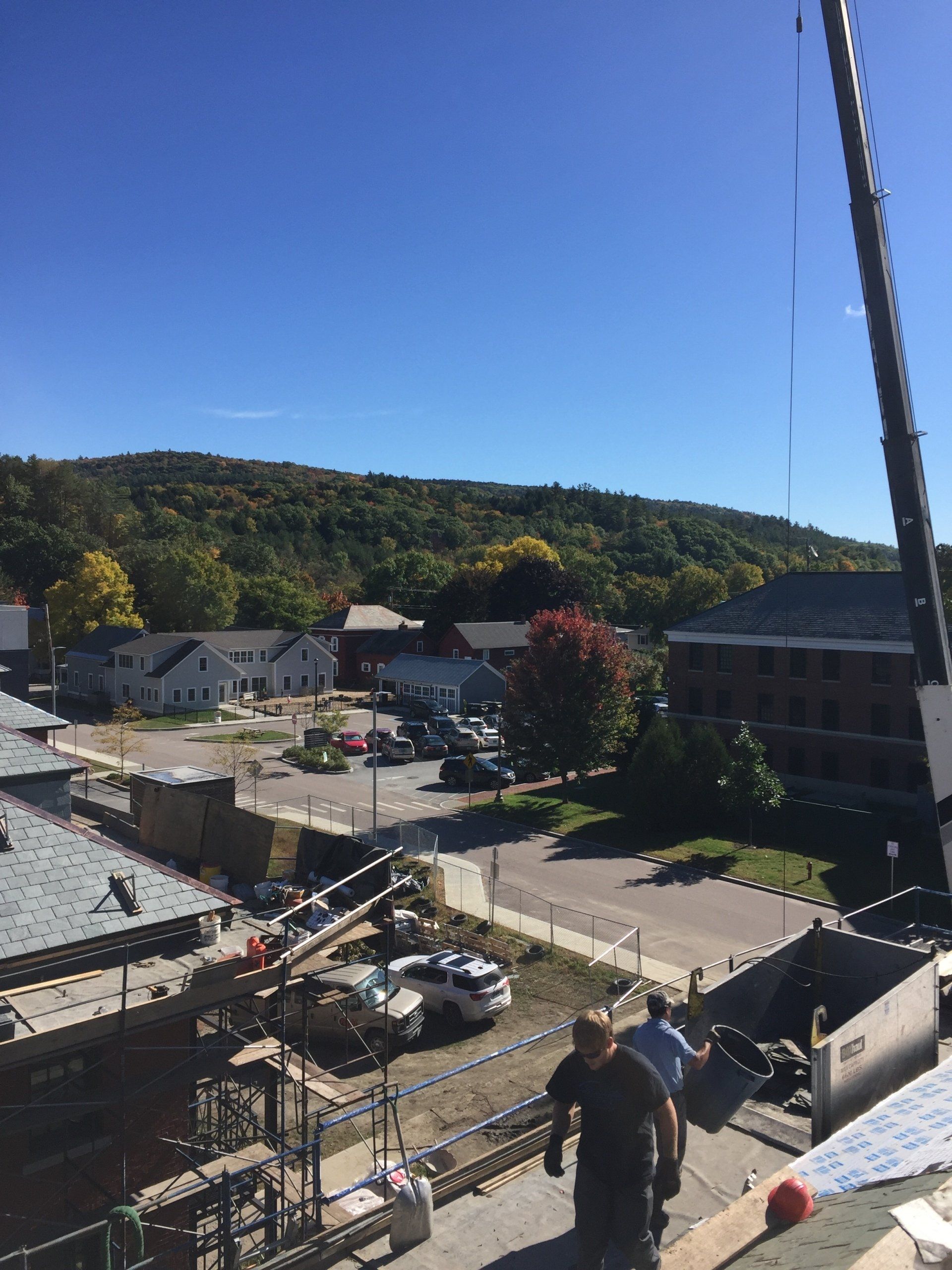 Areal view of the slate roof and brick building completed by Rodd Roofing