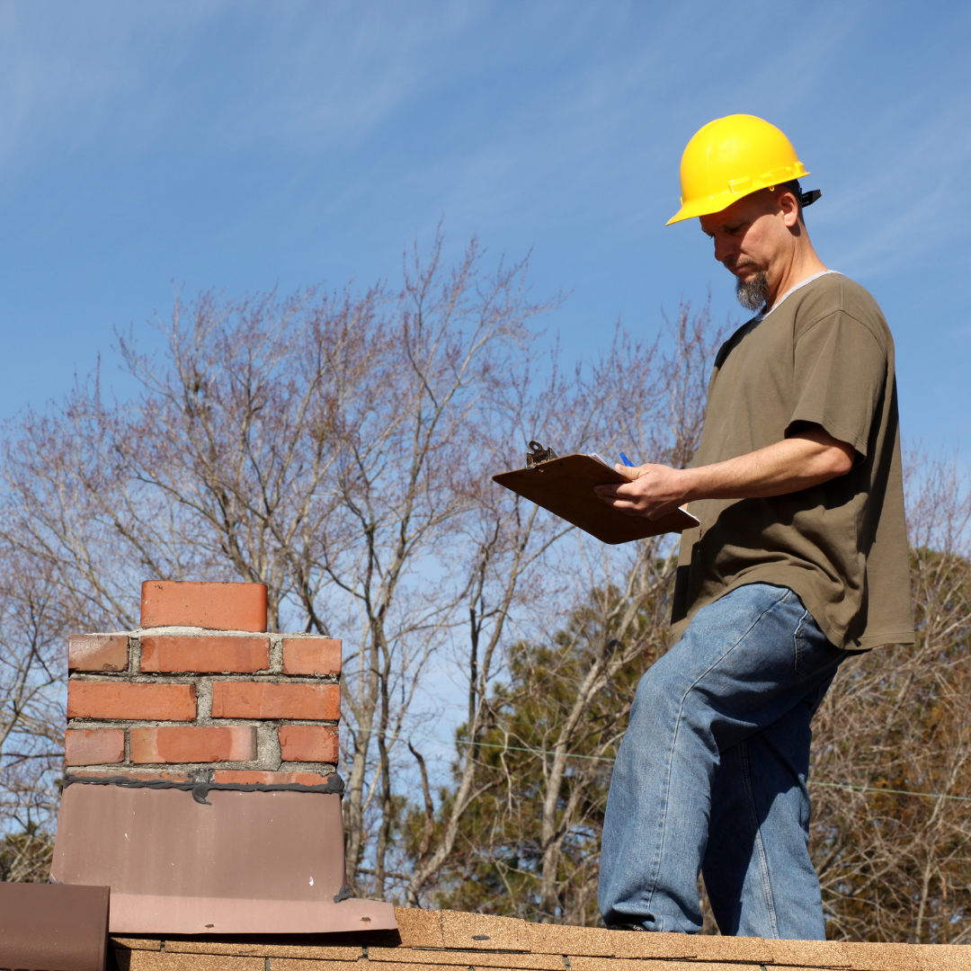 Professional roofer performing a roof inspection