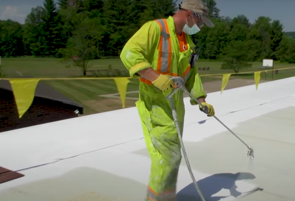 A man preparing a roof for a replacement roof