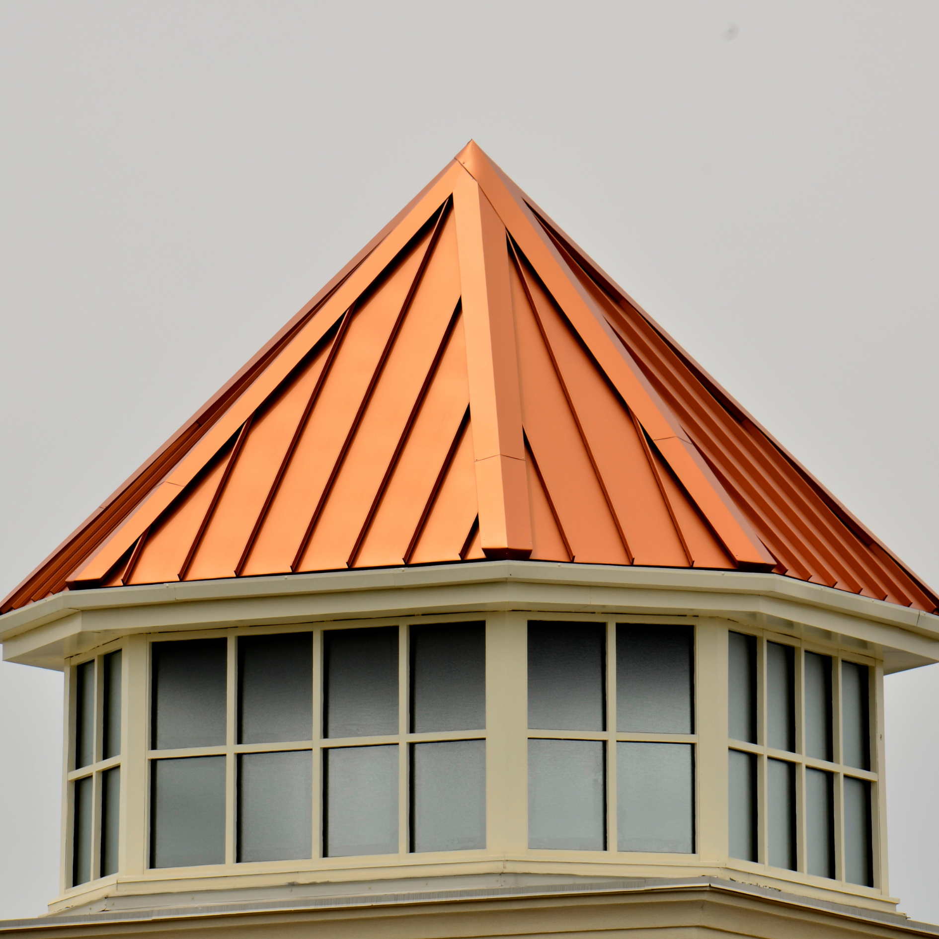 A building with a copper roof installed by Rodd Roofing in Vermont