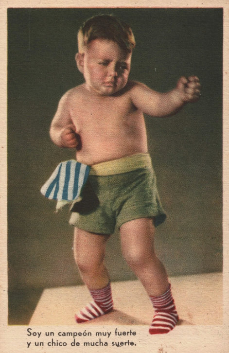 A man is sitting at a desk in front of a whiteboard that says ' i 'm sorry ' on it