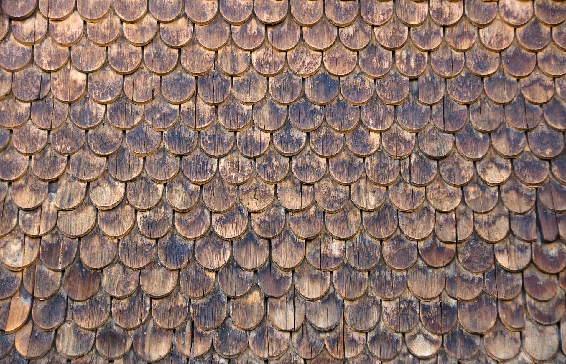 Wooden shingles deteriorate on a roof in Vermont